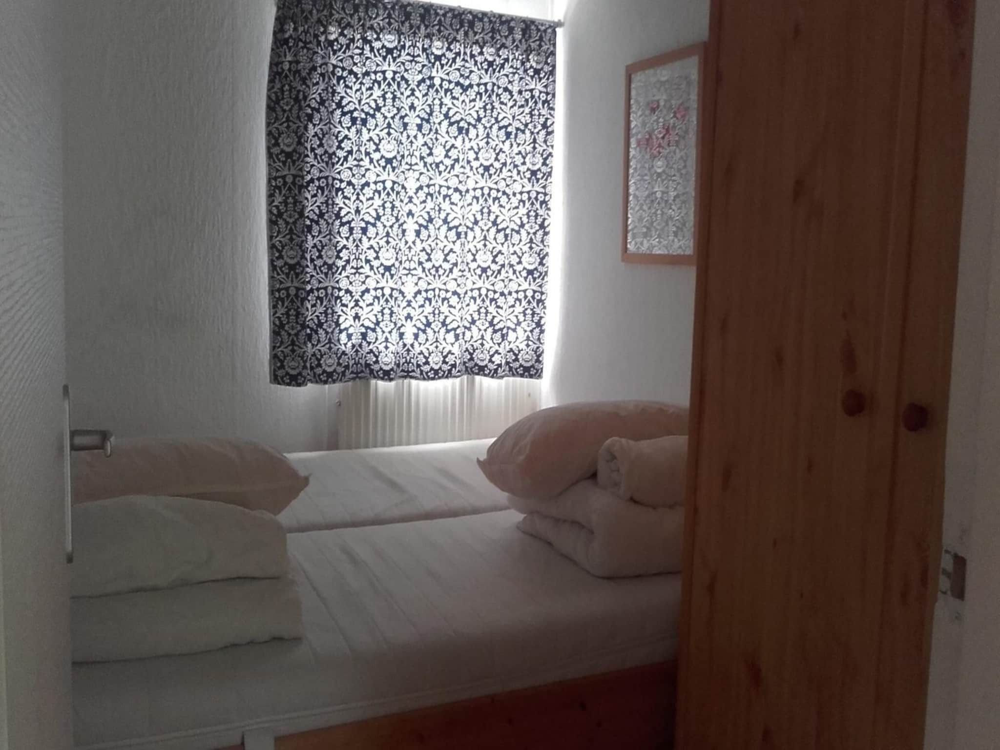 Een slaapkamer van Zeewaard 5 in Sint Maartenszee