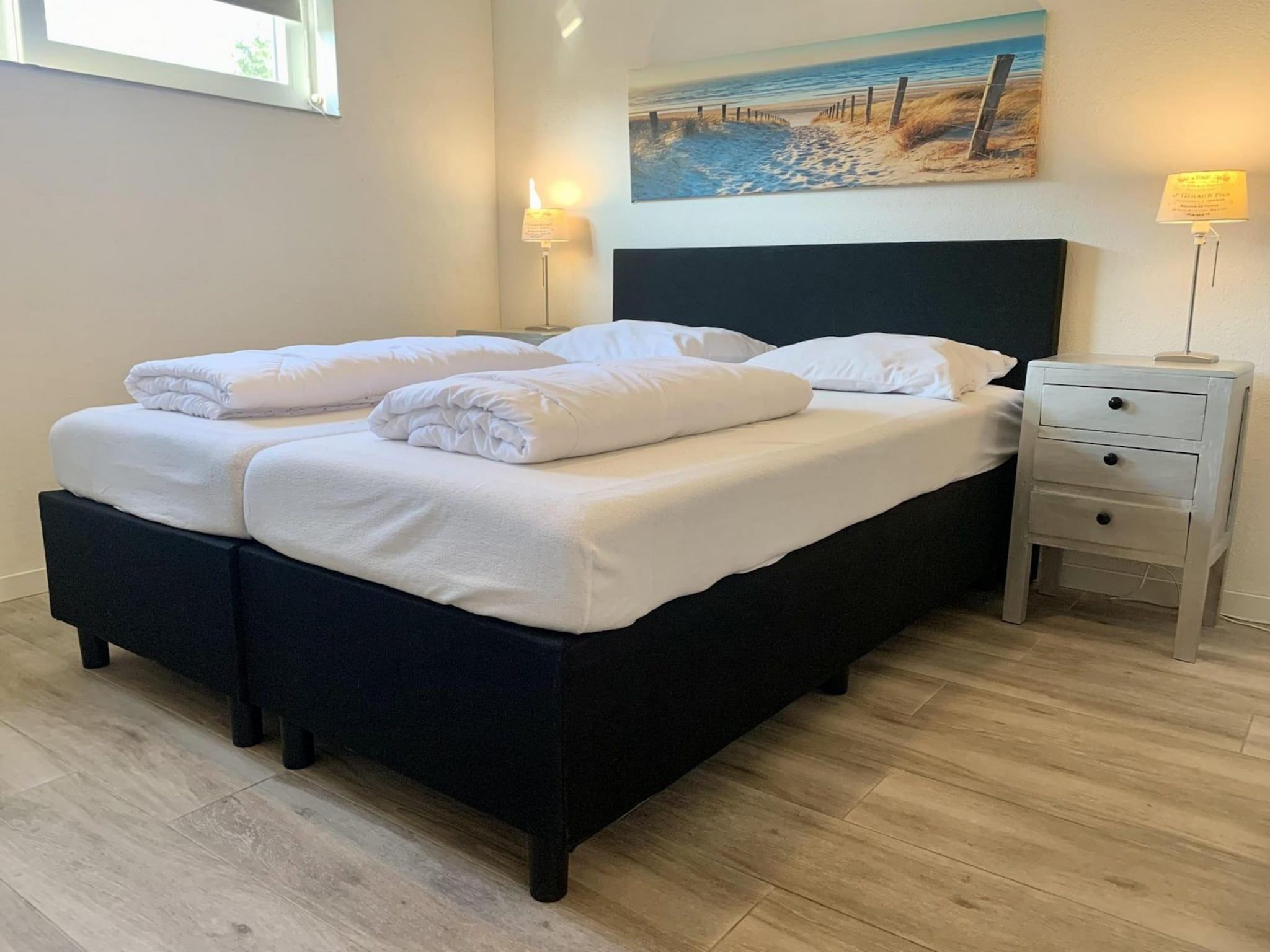 Een slaapkamer van Zeewaard 18 in Sint Maartenszee
