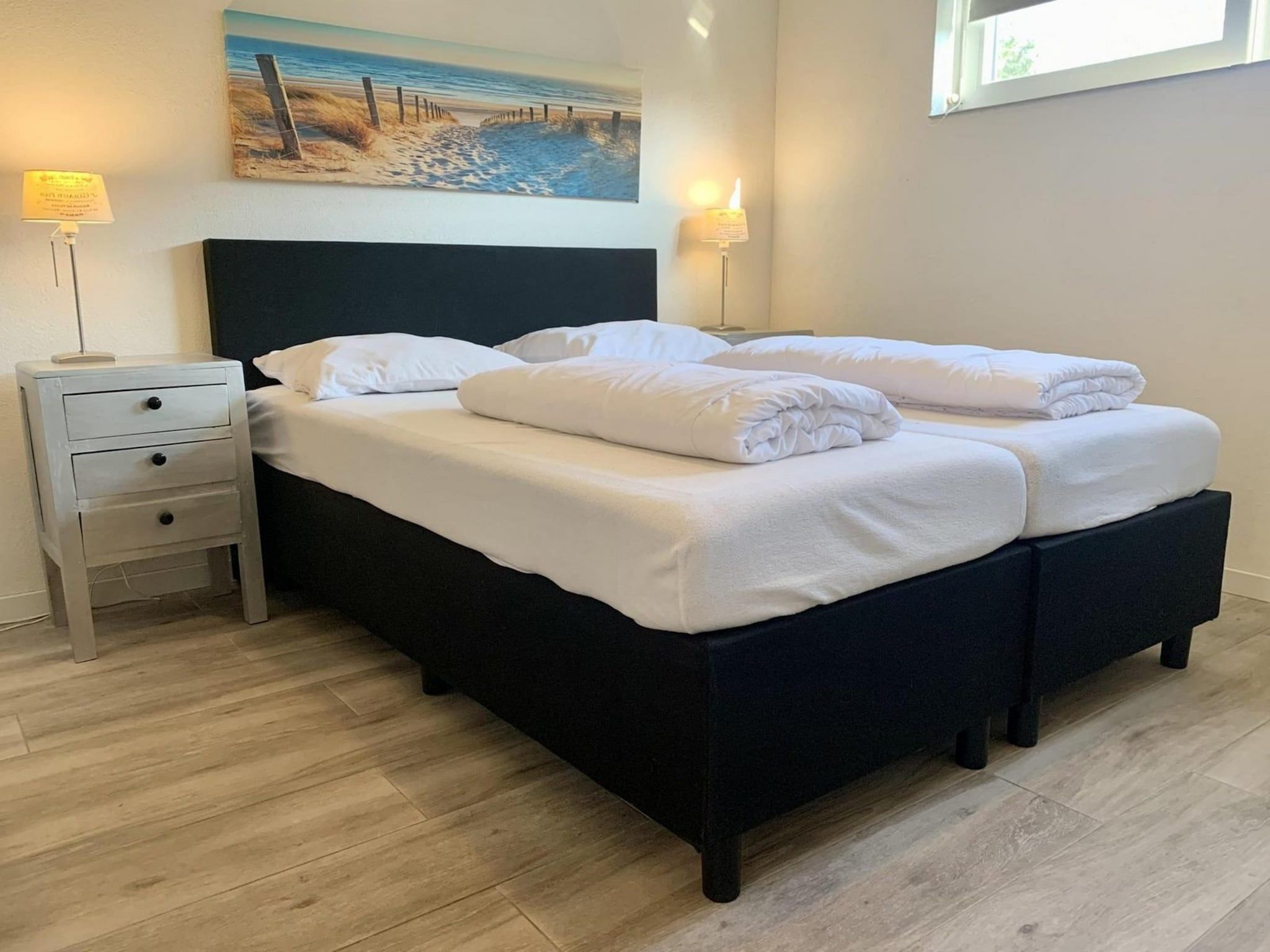Een slaapkamer van Zeewaard 18 in Sint Maartenszee