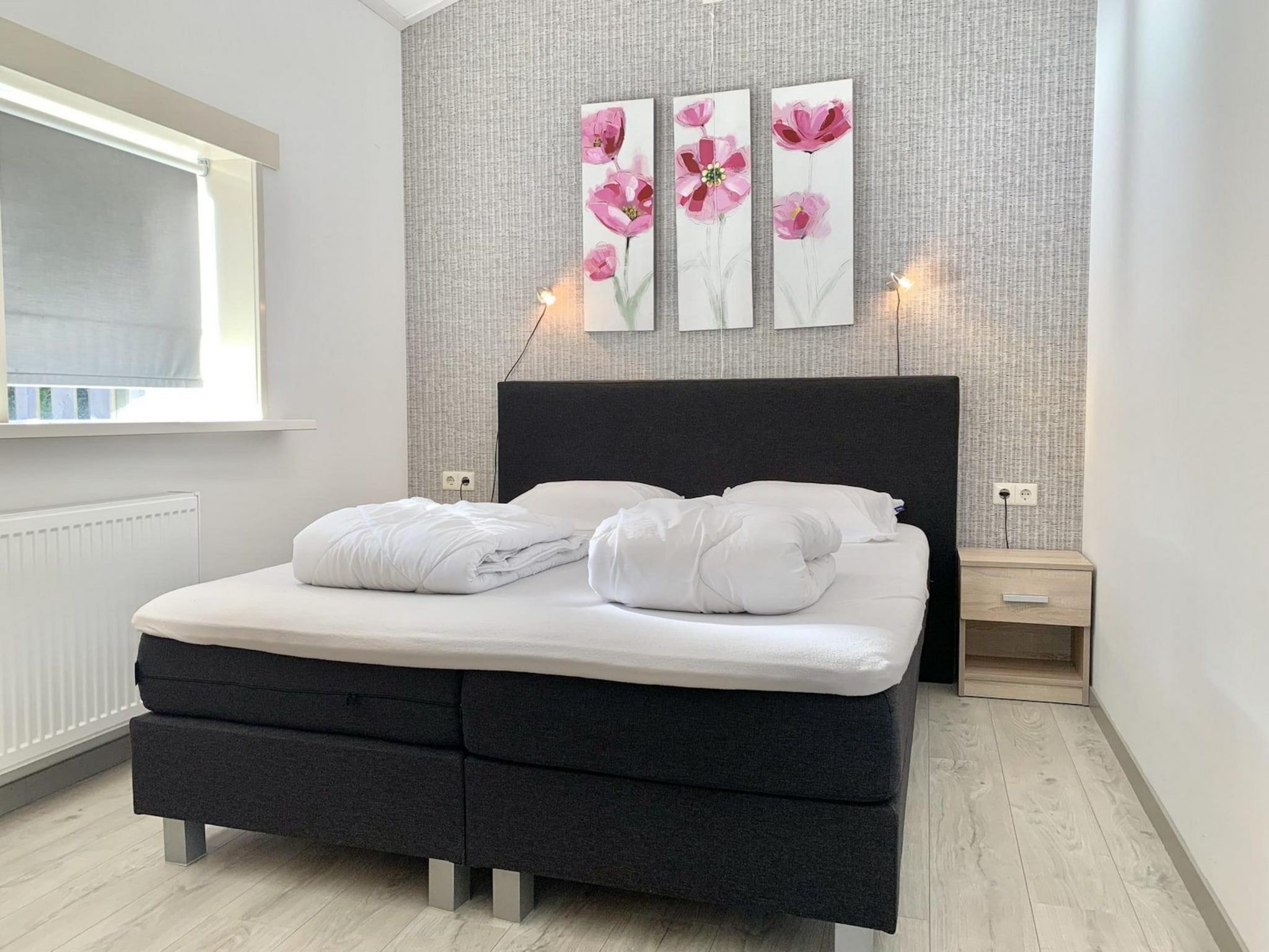 Een slaapkamer van Zeewaard 21 in Sint Maartenszee