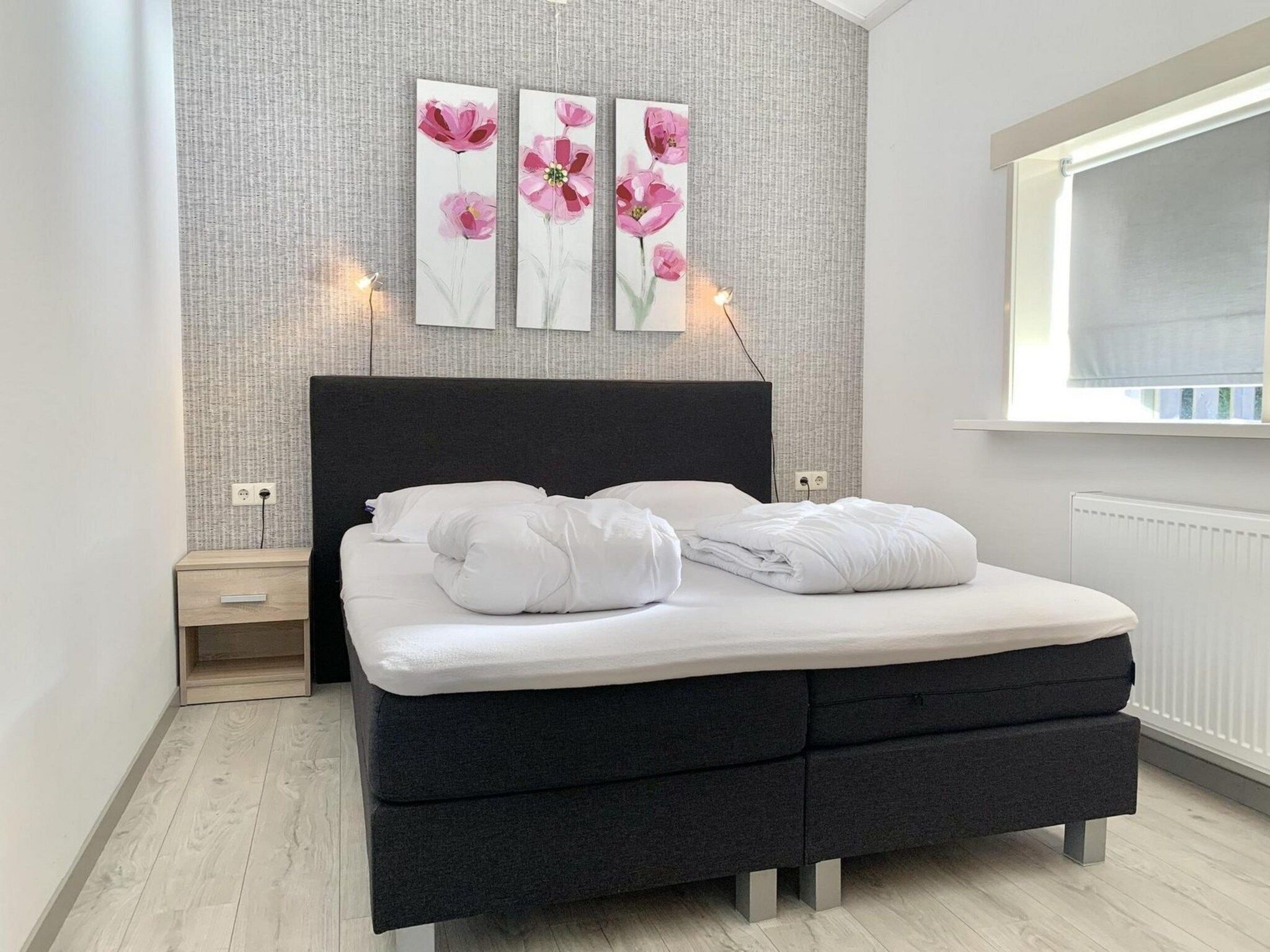 Een slaapkamer van Zeewaard 21 in Sint Maartenszee