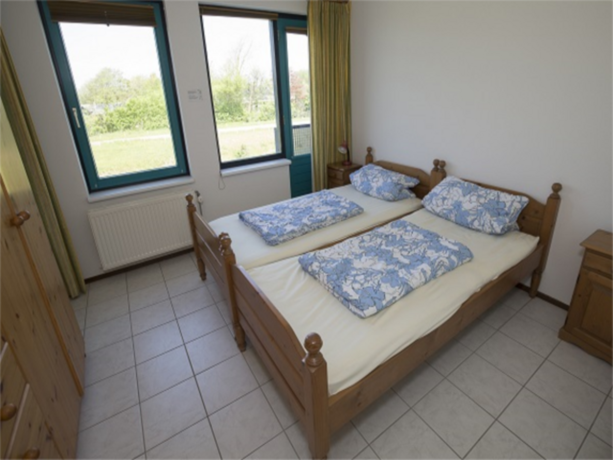 Een slaapkamer van Zeeweg 49 in Sint Maartenszee