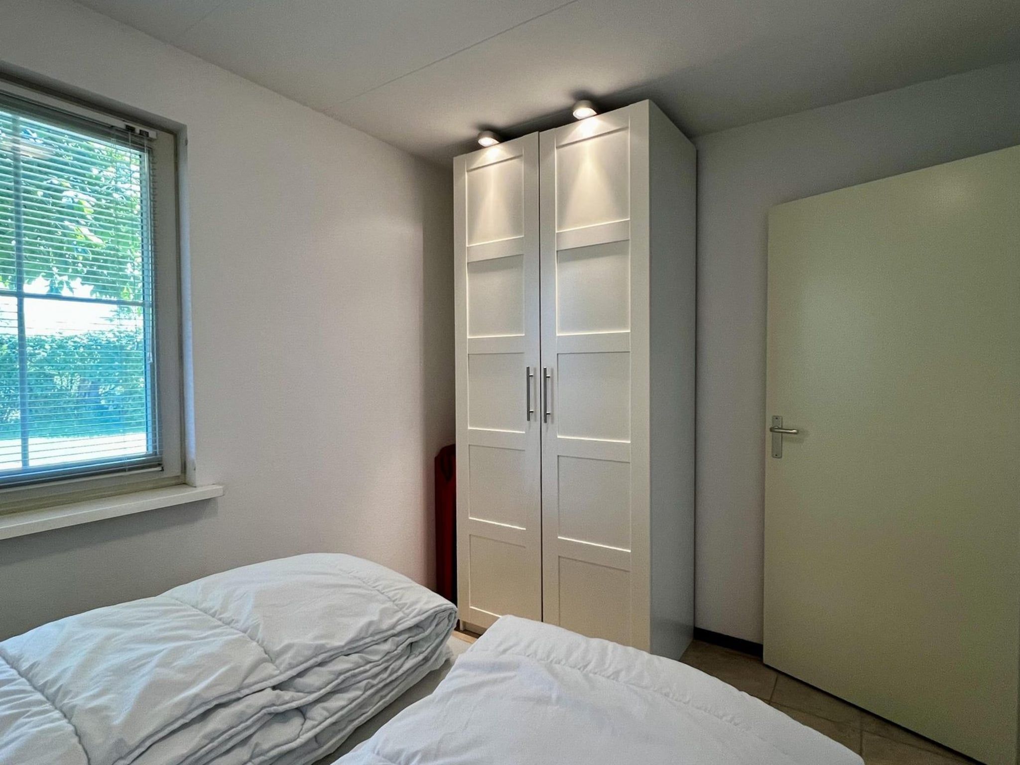 Een slaapkamer van Eureka 100 in Sint Maartenszee