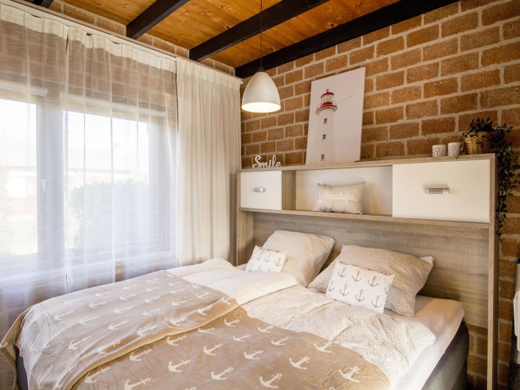 Een slaapkamer van Boerenslag 28 in Sint Maartenszee