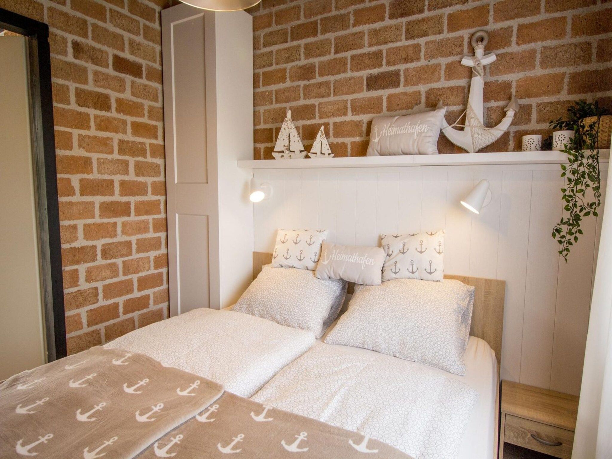 Een slaapkamer van Boerenslag 28 in Sint Maartenszee
