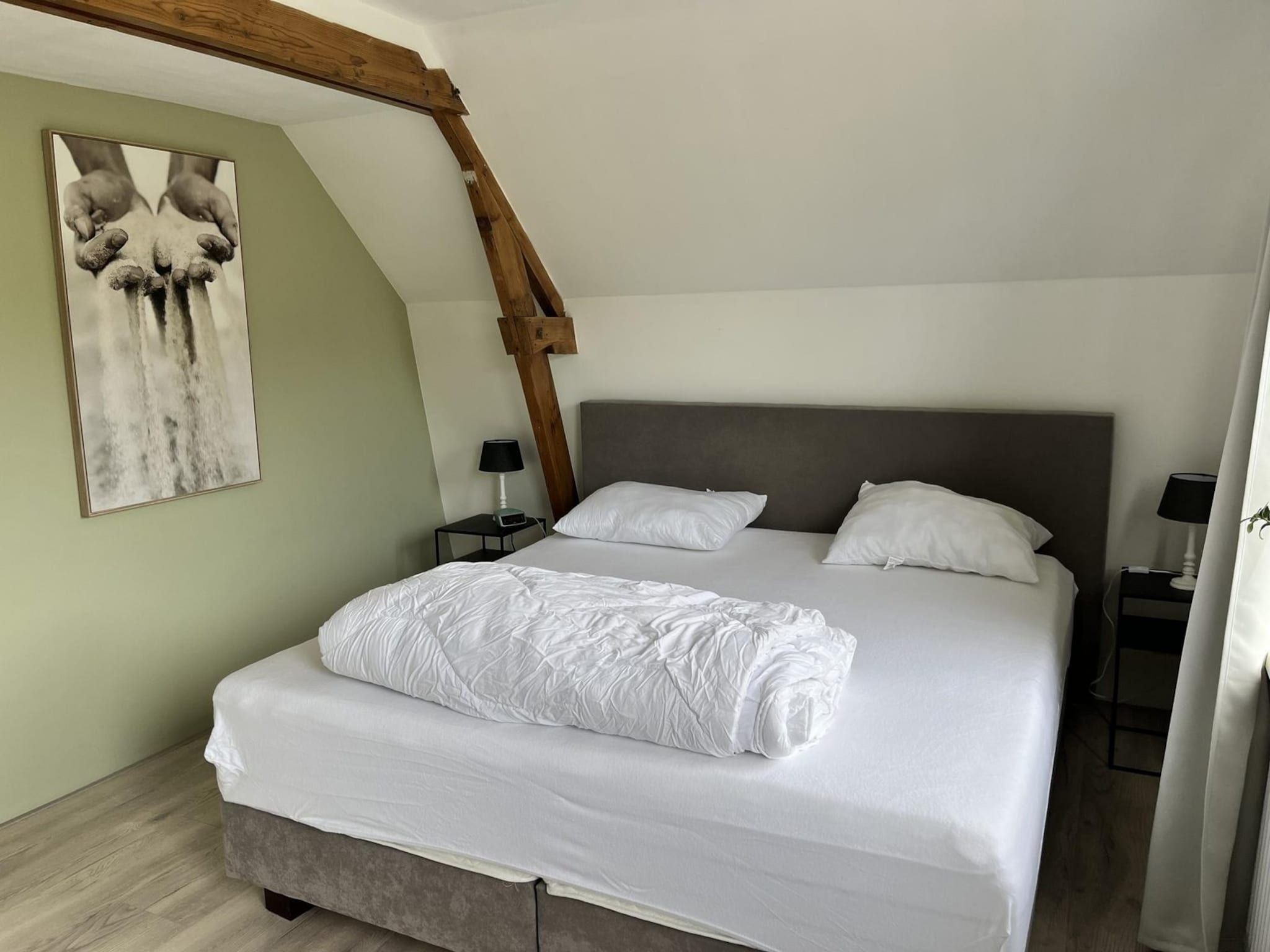Een slaapkamer van Sint Maartensweg 38 in Sint Maartensvlotbrug
