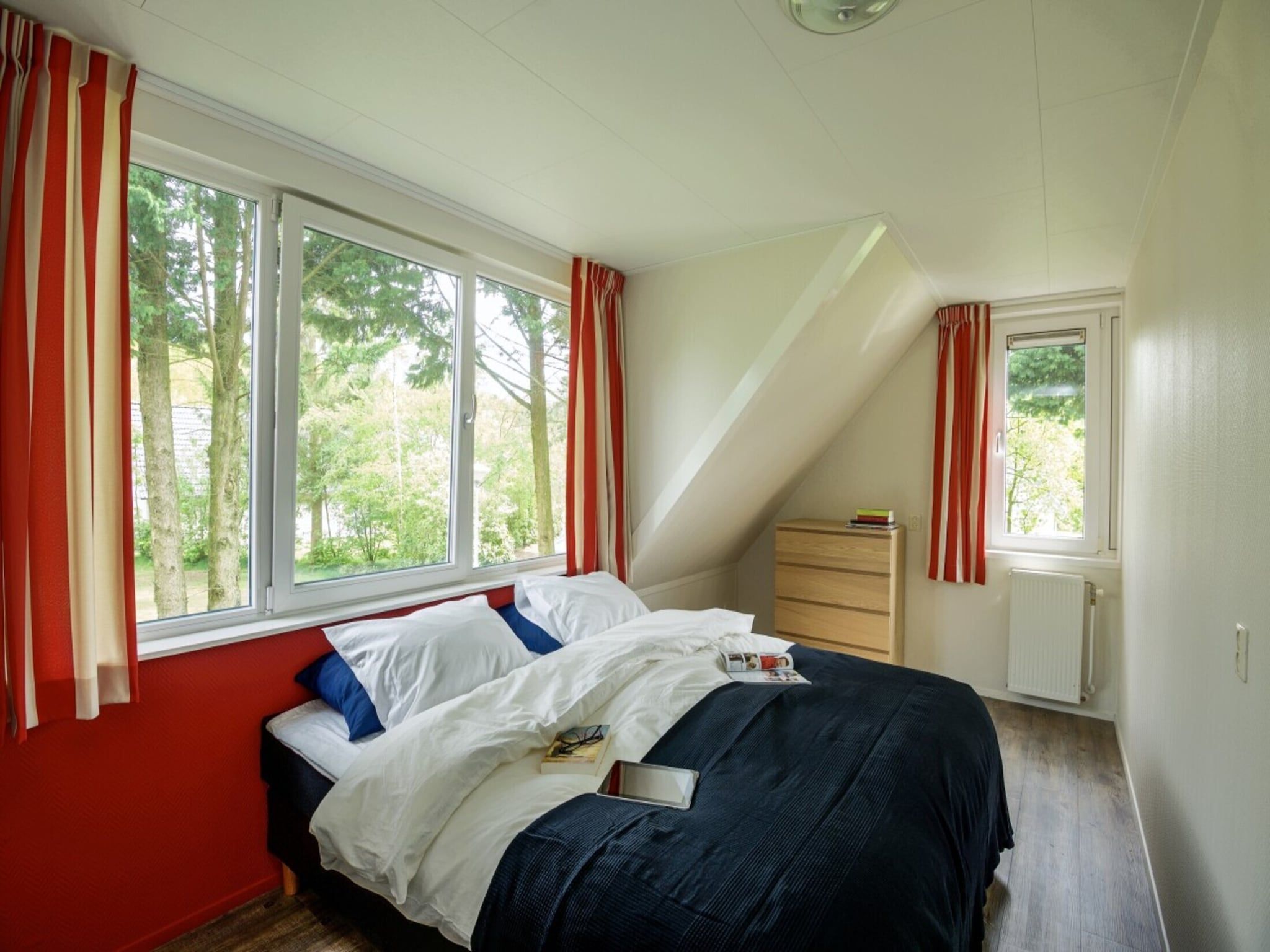 Een slaapkamer van Holiday home 8 persons Premium in Scherpenzeel