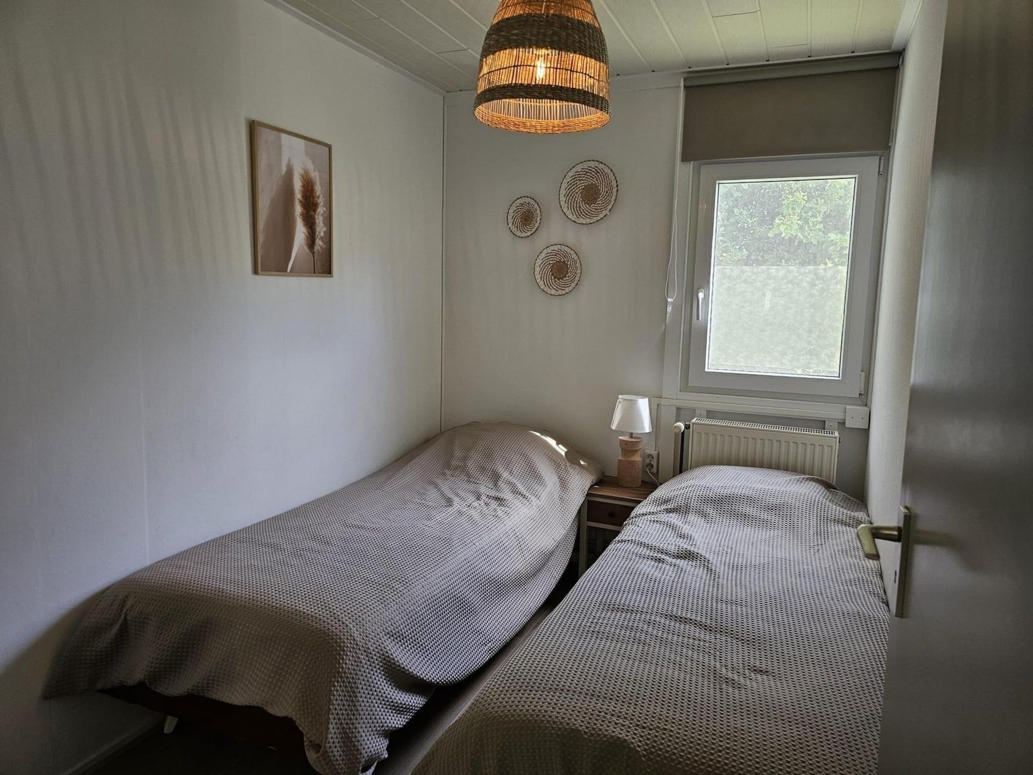Een slaapkamer van Eb en Vloed 62 in Sint Maartenszee