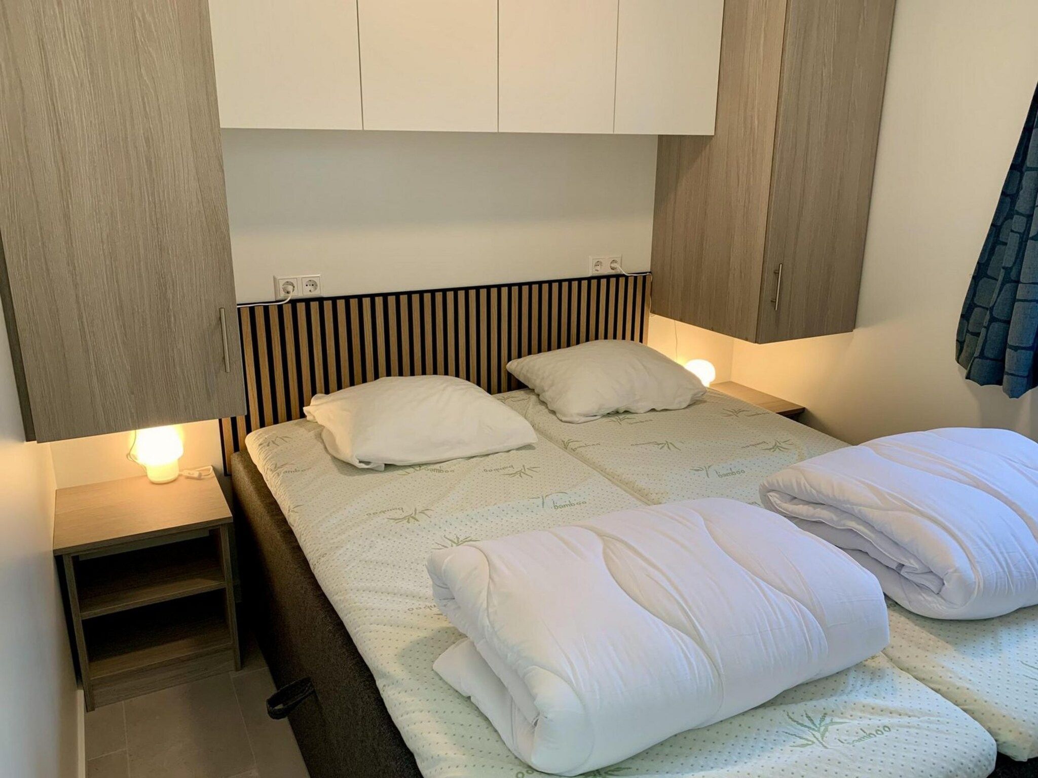 Een slaapkamer van Campanula 136 in Sint Maartenszee