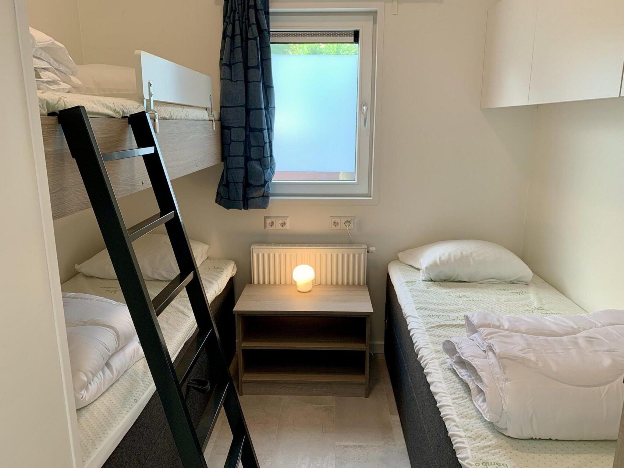 Een slaapkamer van Campanula 136 in Sint Maartenszee
