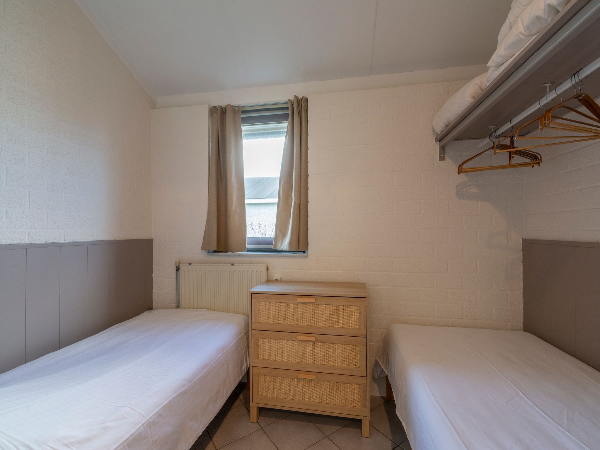 Een slaapkamer van Watersnip 57 "Huis Skuumkoppe" in Petten