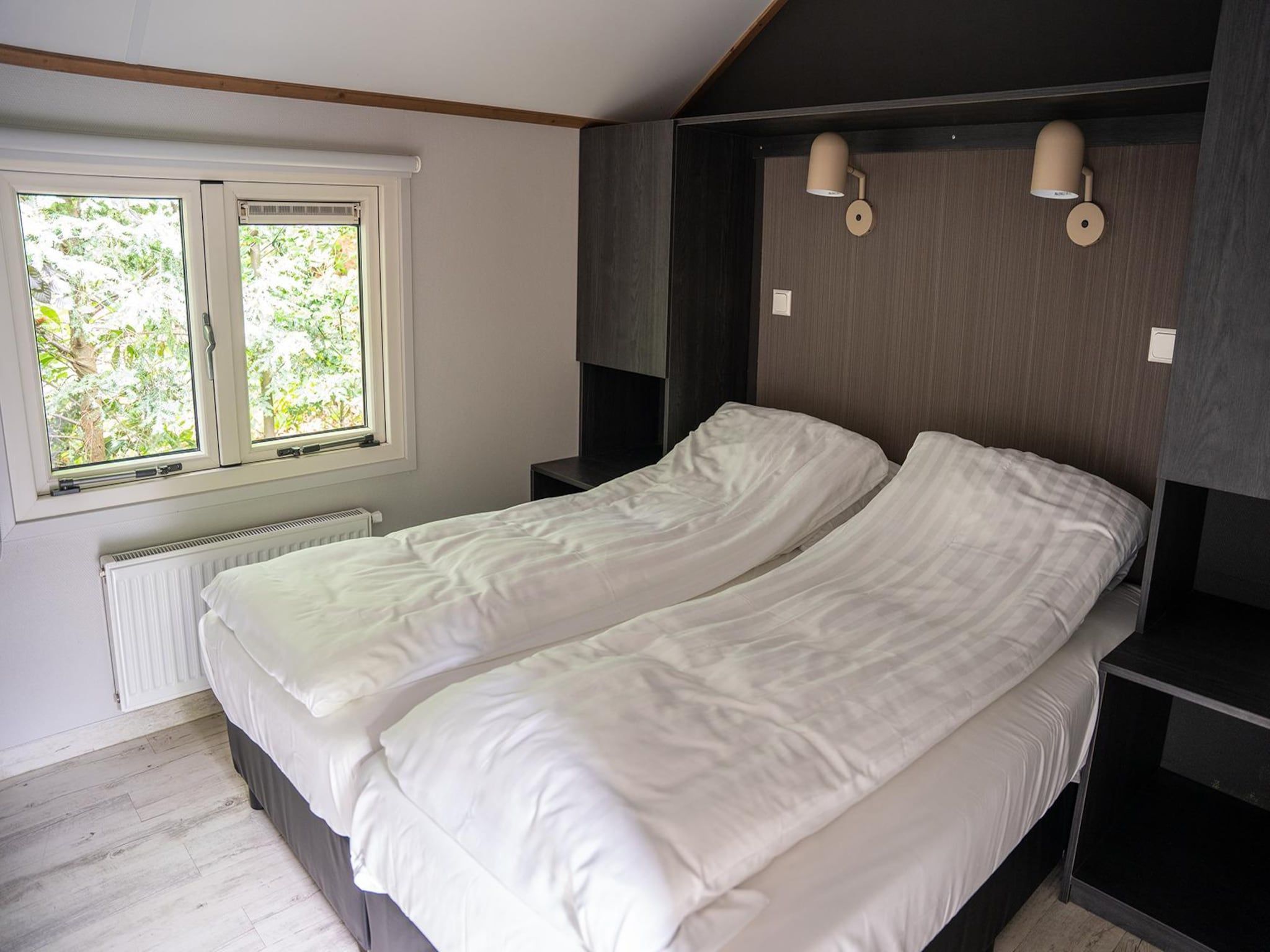 Een slaapkamer van Heivlinder Comfort 4p in Ermelo