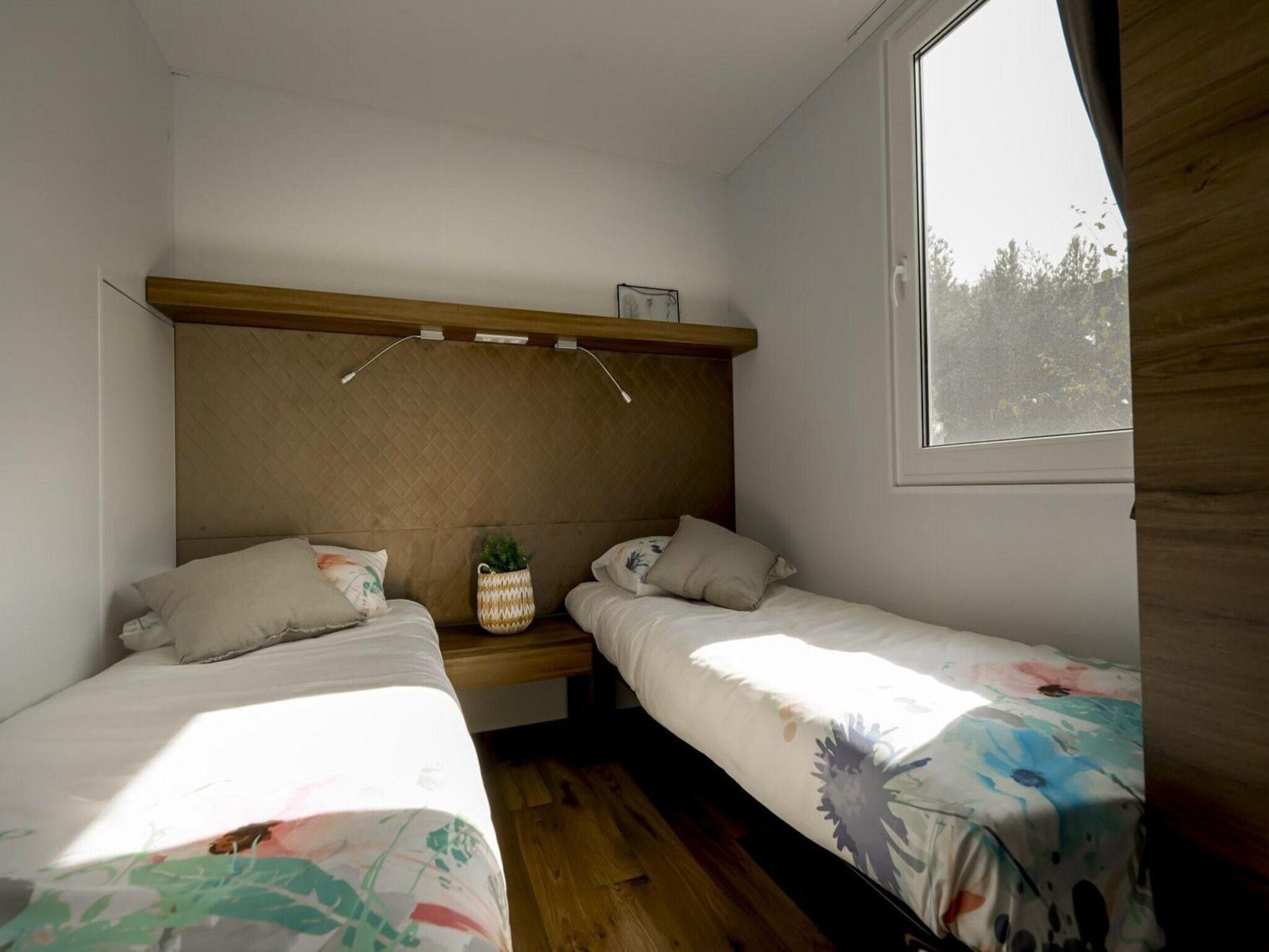 Een slaapkamer van Cosy Unique Plus 6 in Belfeld