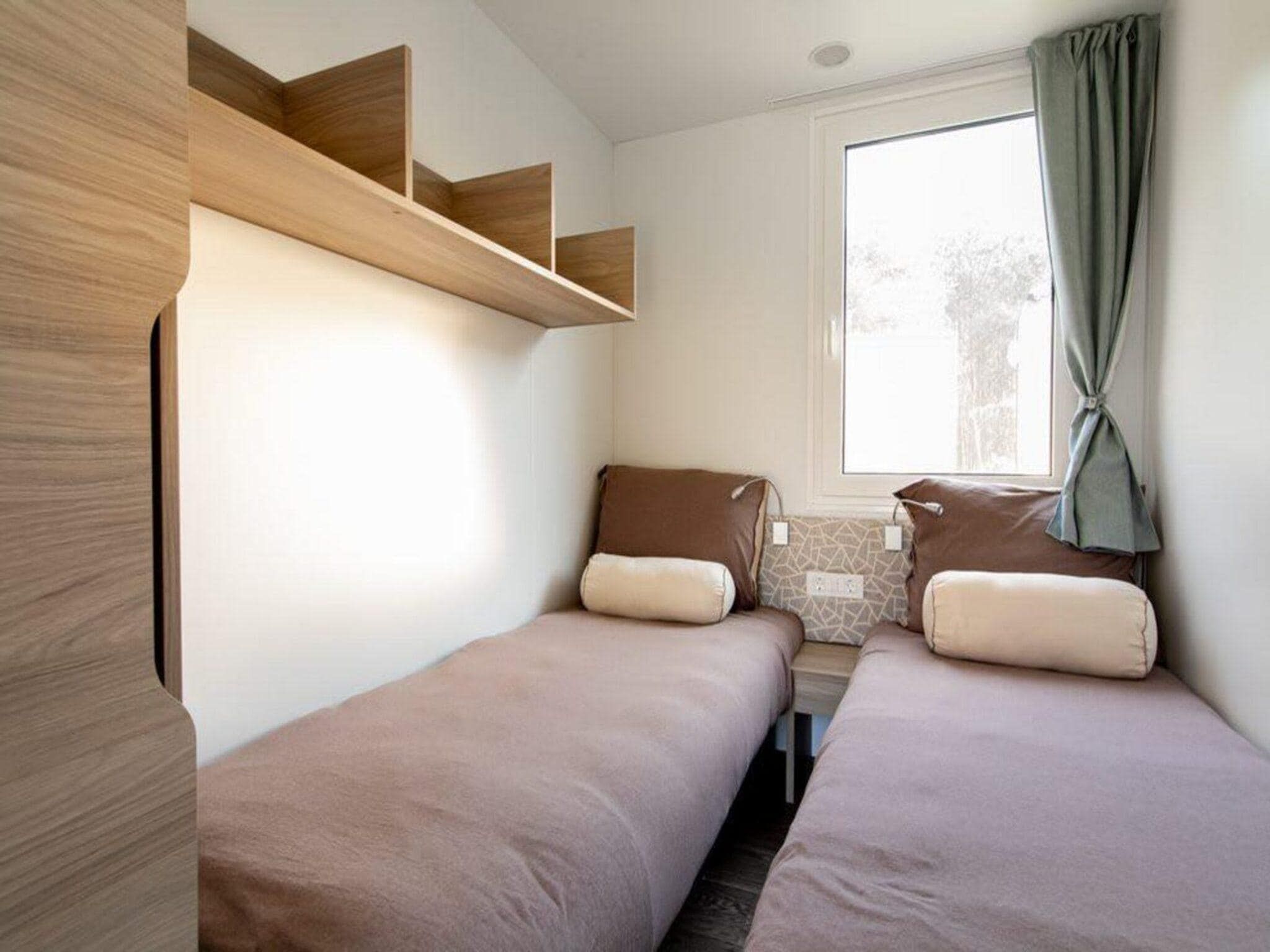 Een slaapkamer van Cosy Unique Plus 6 in Belfeld