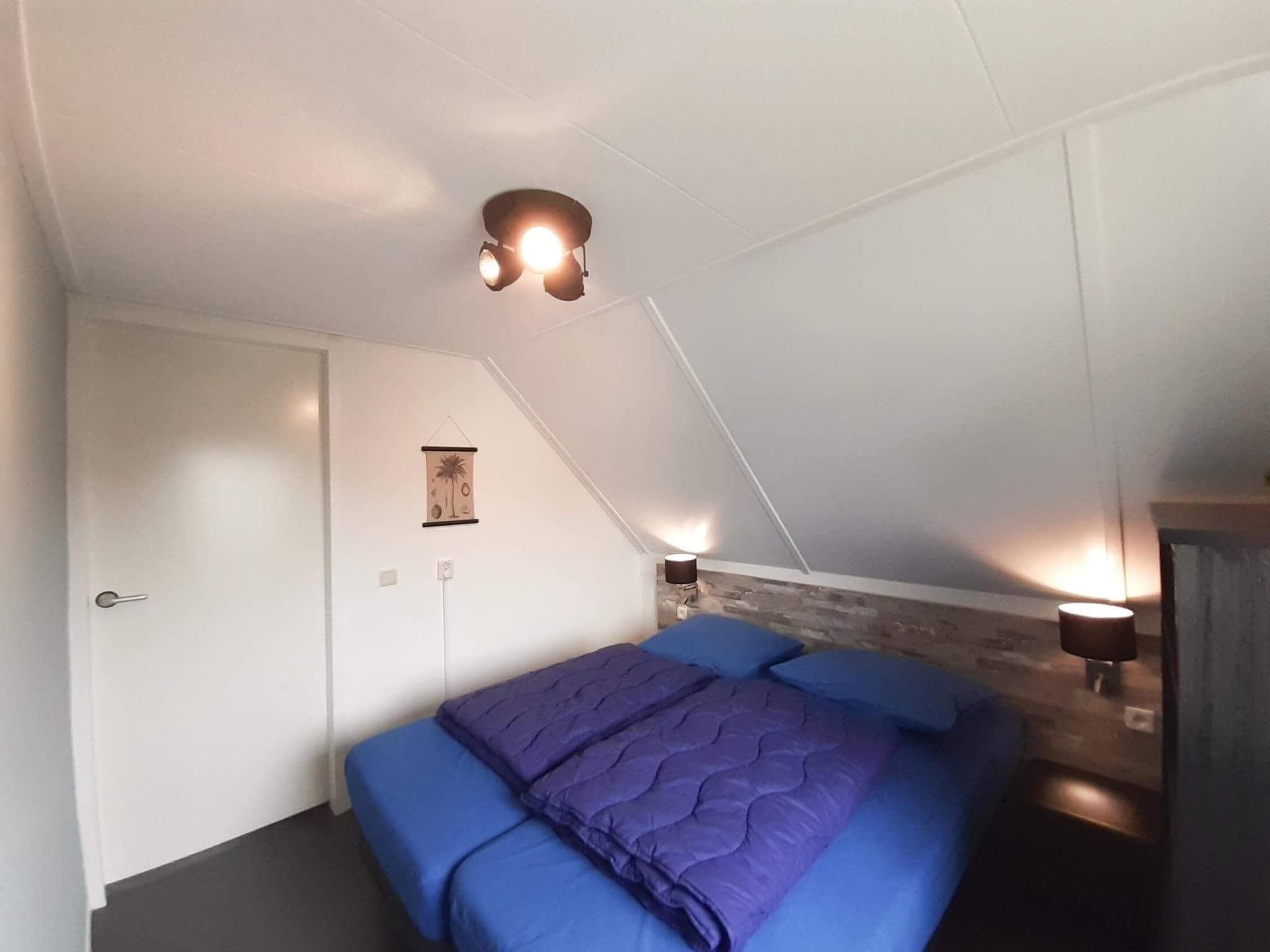 Een slaapkamer van Dijkhuis Sauna 6 in Medemblik