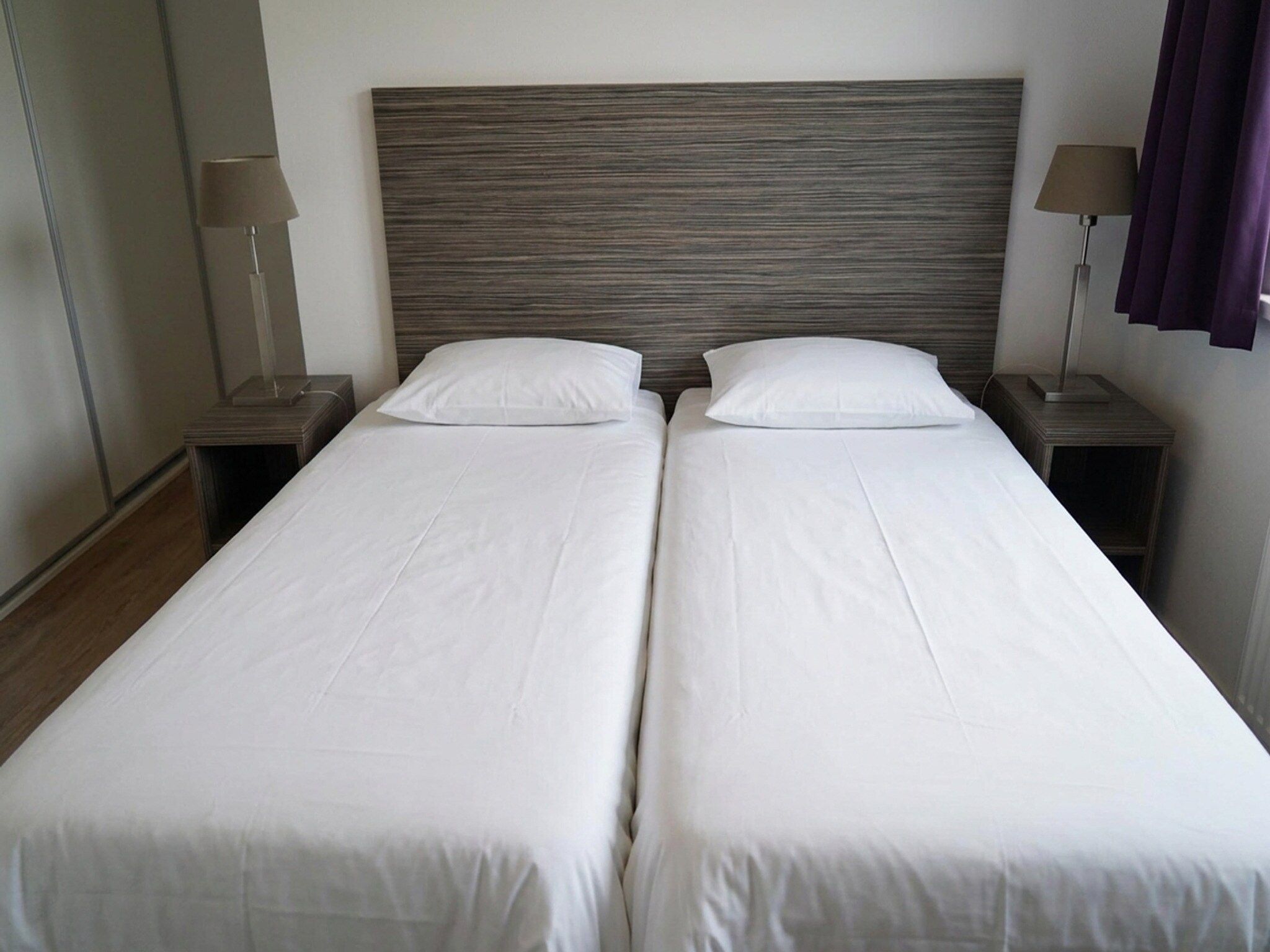 Een slaapkamer van Comfort 5 people in Noordwijk