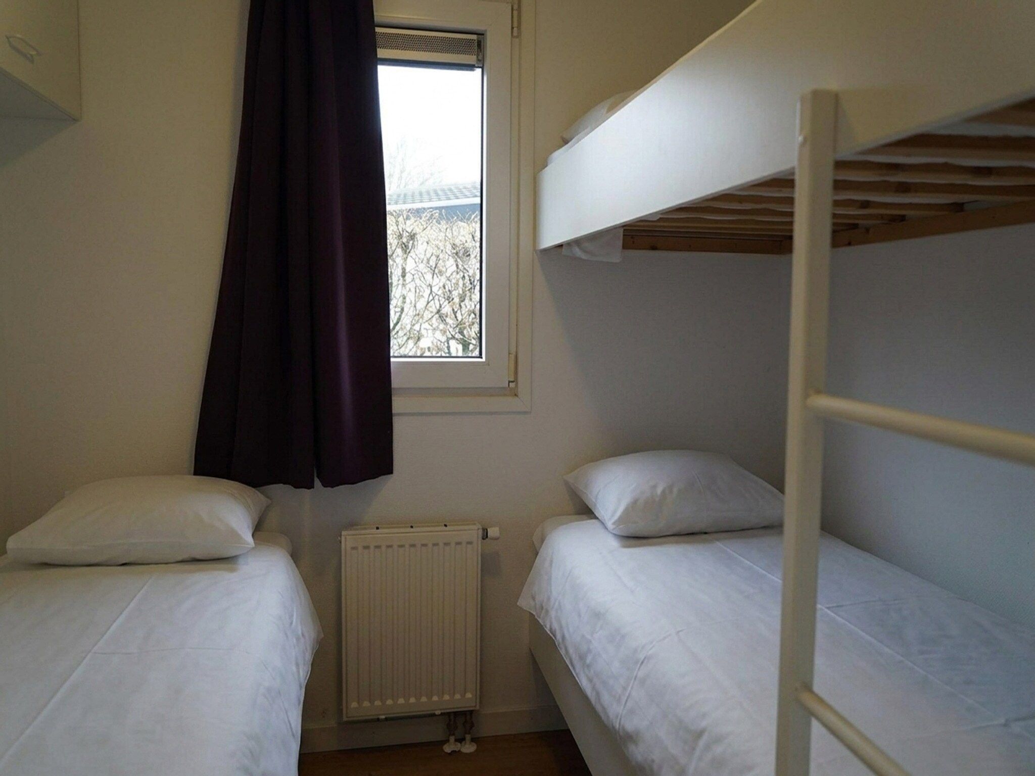 Een slaapkamer van Comfort 5 people in Noordwijk