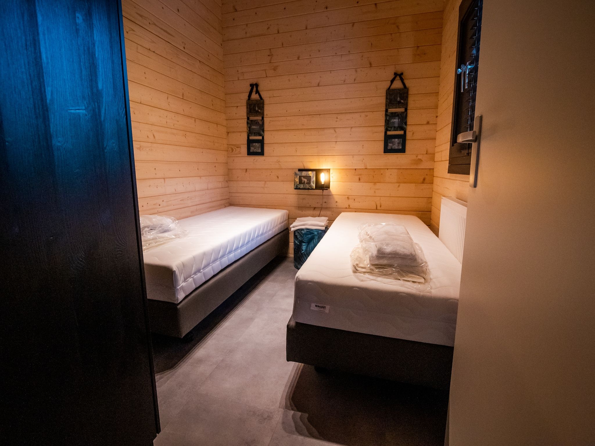 Een slaapkamer van 4-persoons wellness lodge in Markelo