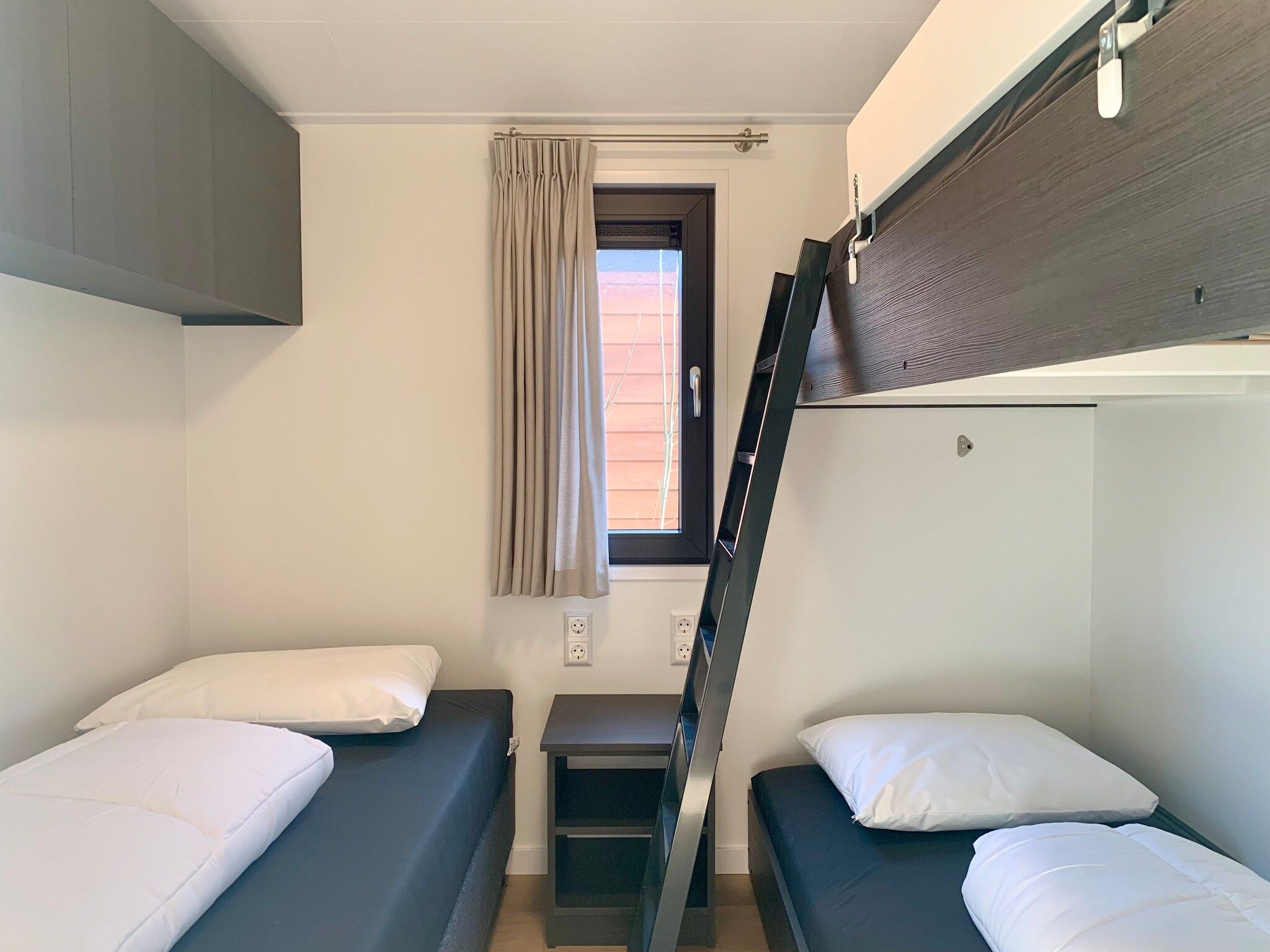 Een slaapkamer van Campanula 120 in Sint Maartenszee