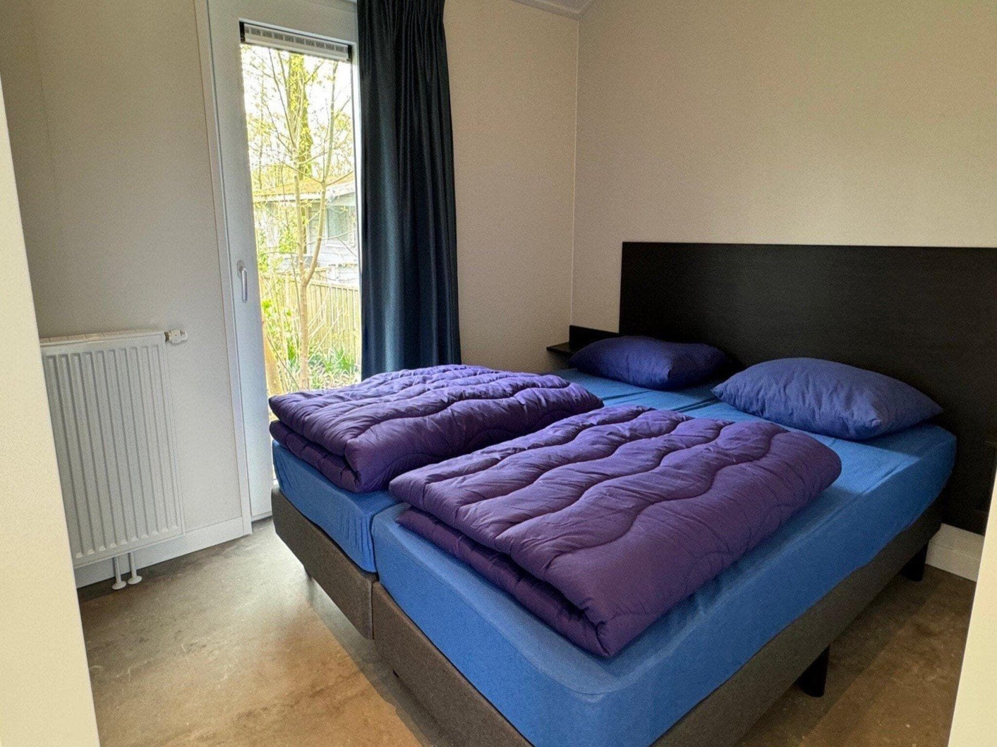 Een slaapkamer van Chalet Egel in Hengelo
