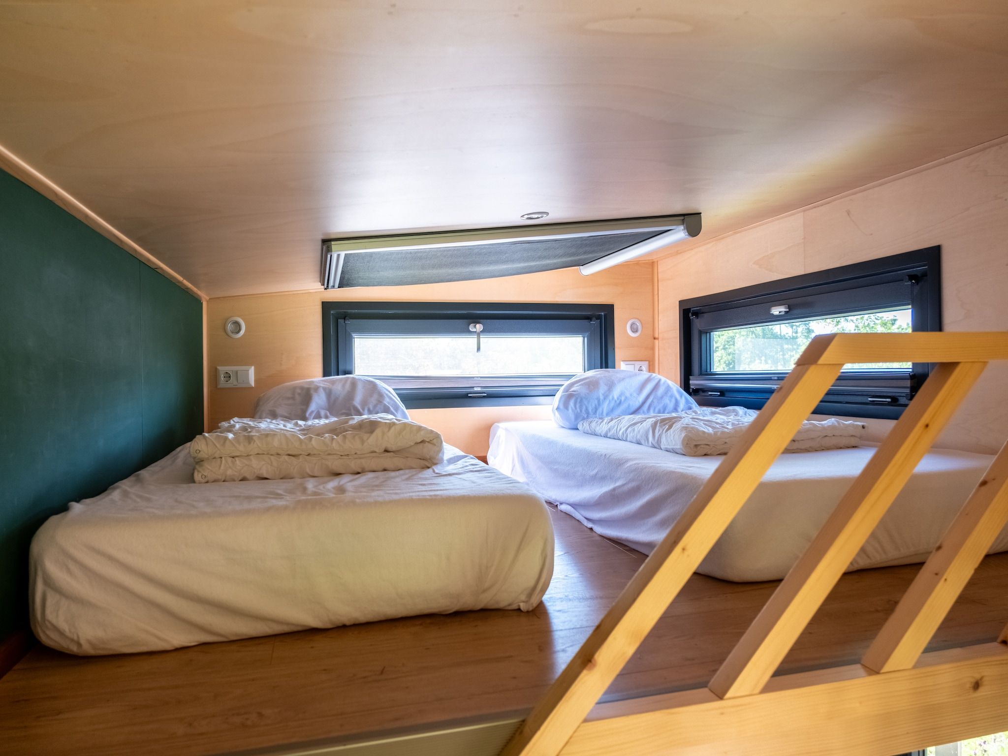 Een slaapkamer van Groepsruimte i.c.m. 4 tiny greenhouses in Scherpenzeel (FR)
