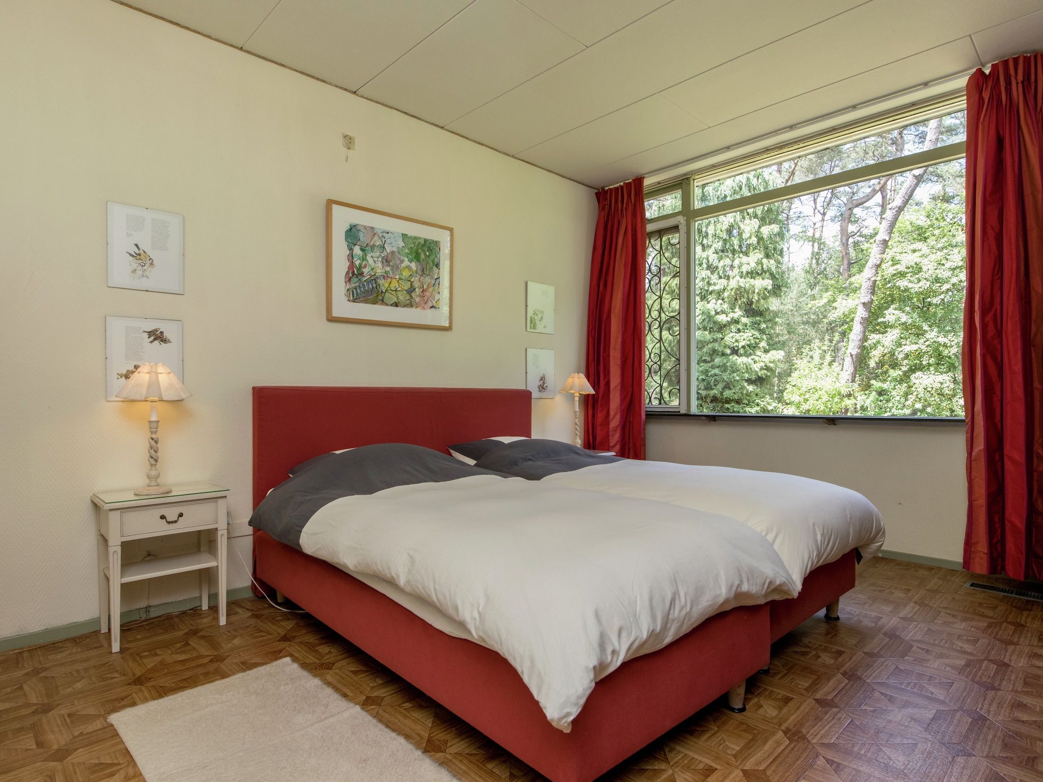 Een slaapkamer van Ruischende Dennen in Huybergen