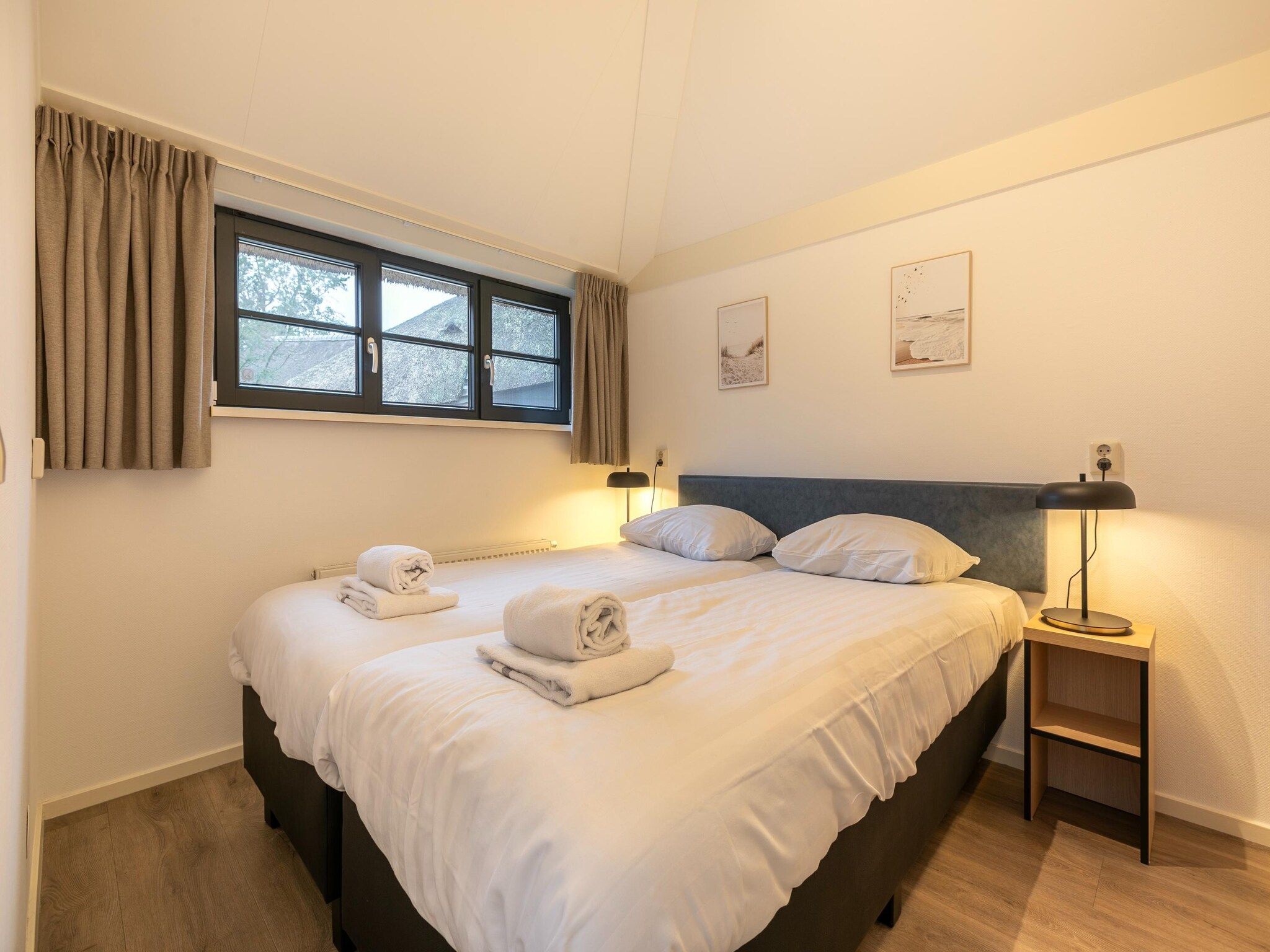 Een slaapkamer van Buitenhuis Wellness in Schoorl