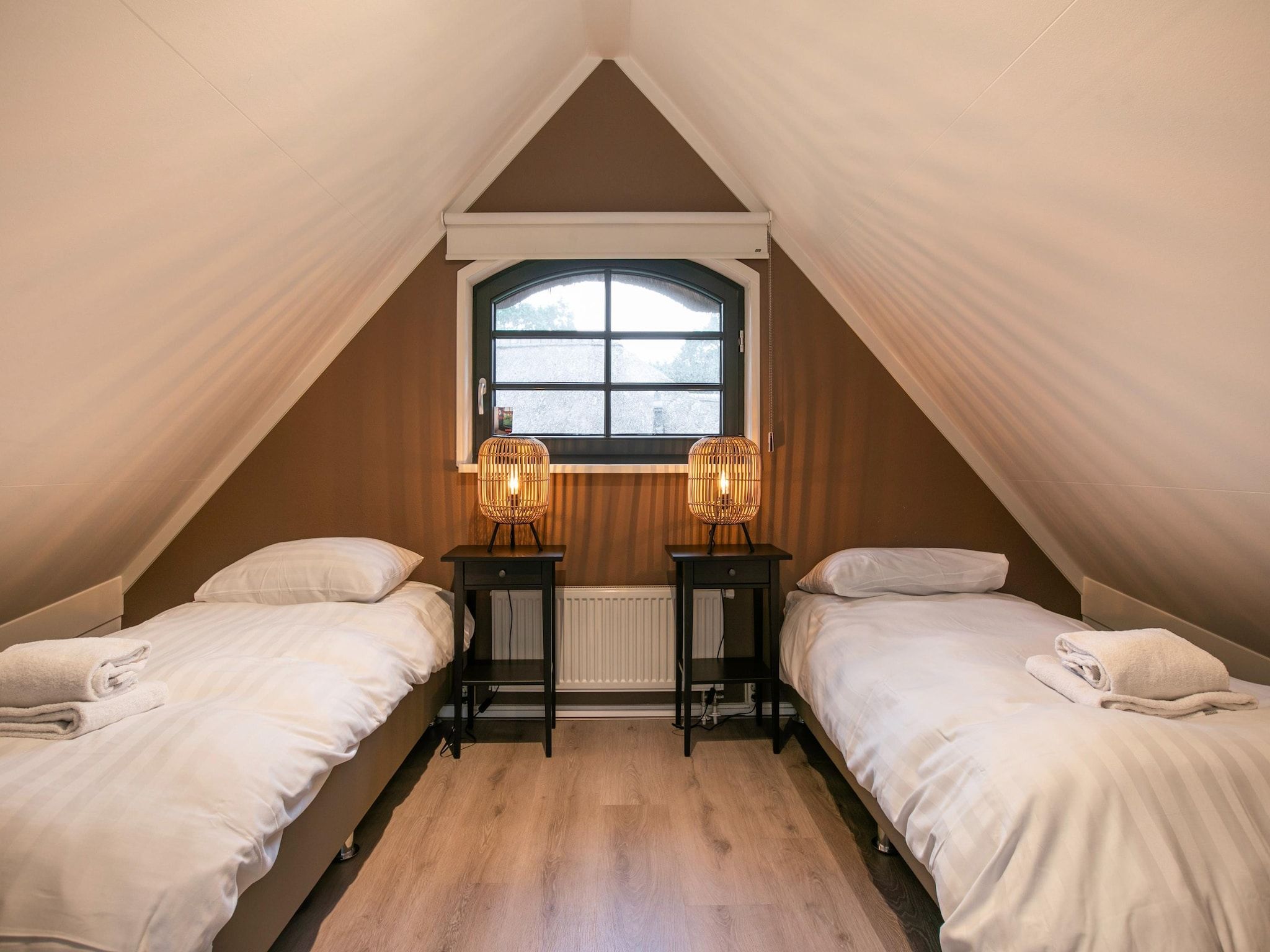 Een slaapkamer van Buitenhuis Wellness in Schoorl