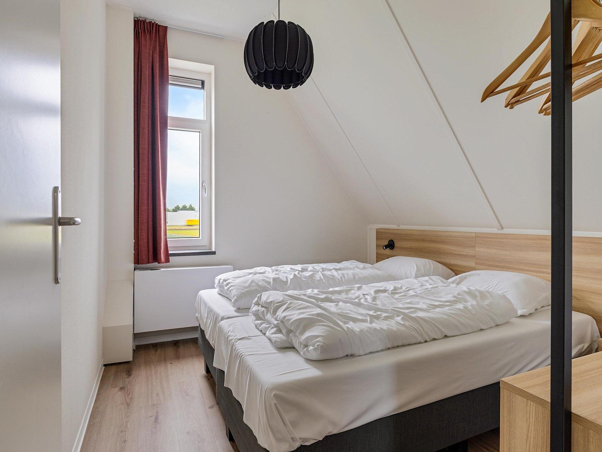 Een slaapkamer van Koggehuys Binnen in PS Opperdoes