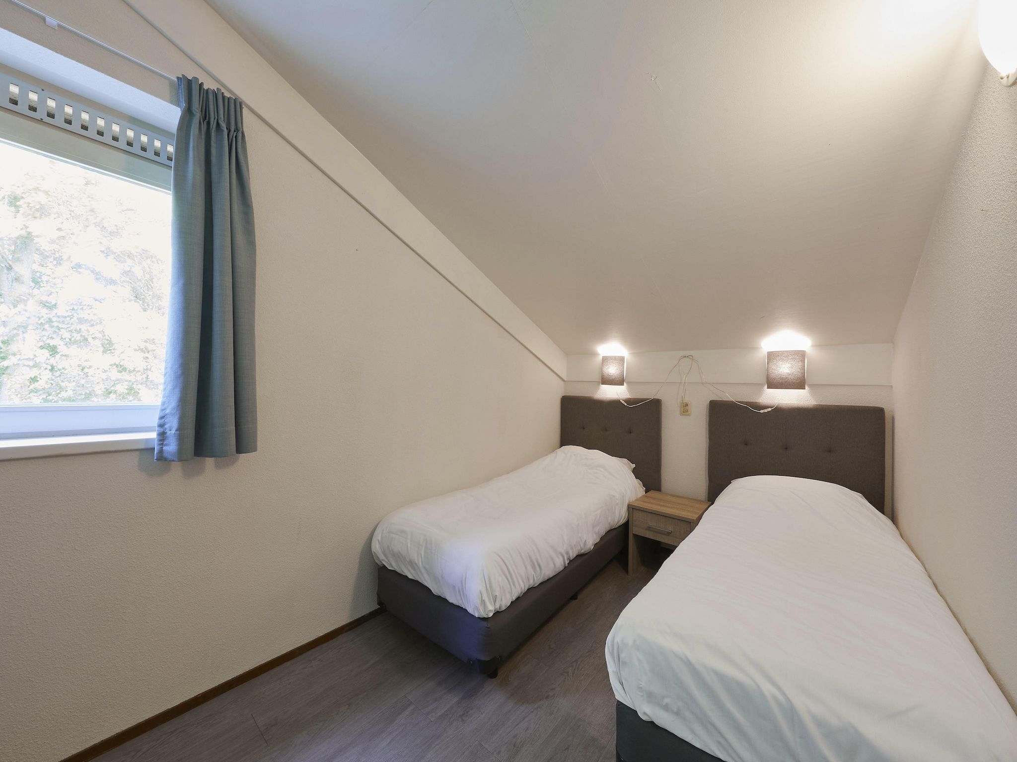 Een slaapkamer van Vakantiepark Kijkduin 6 in Den Haag