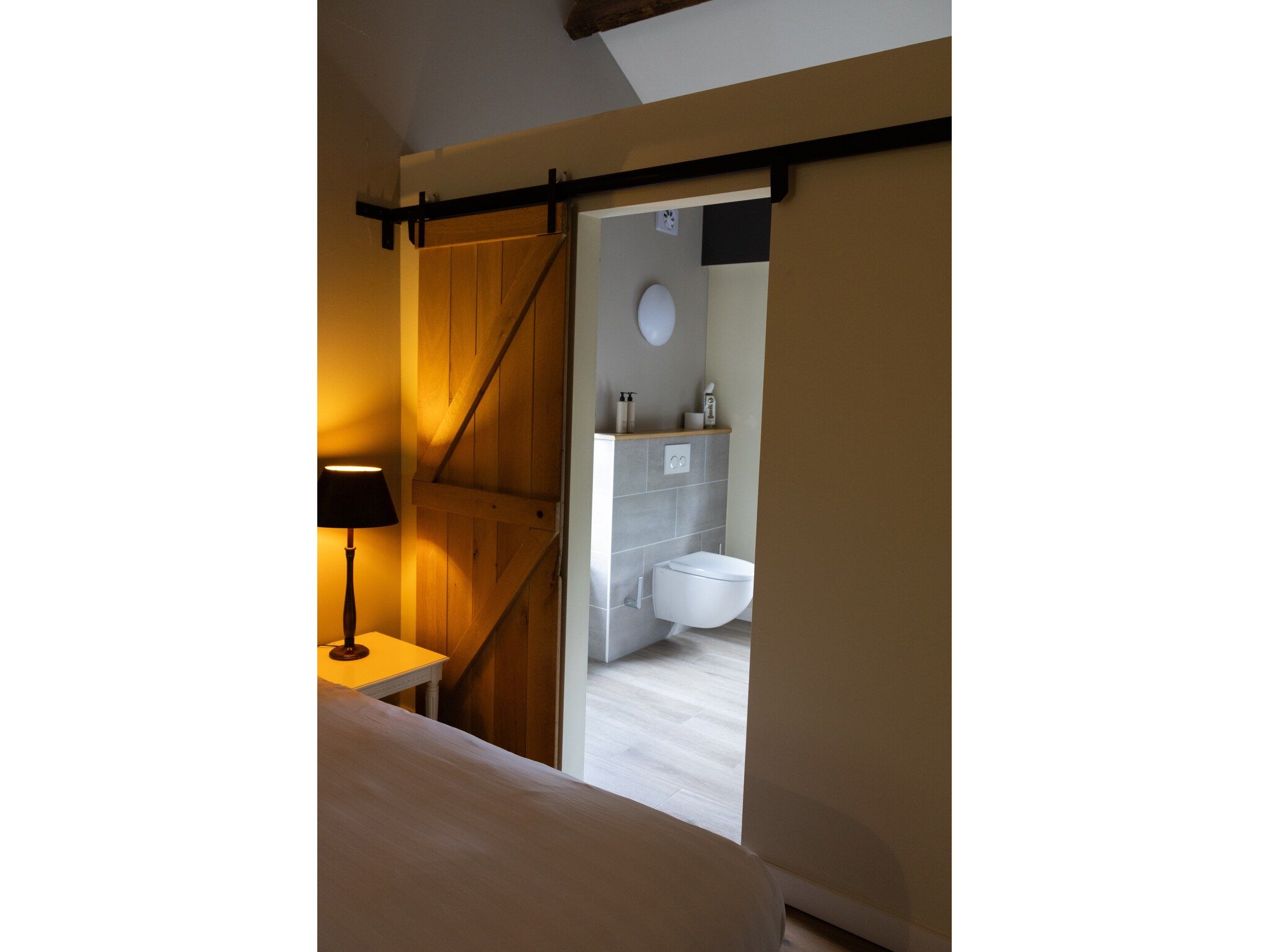 Een slaapkamer van Luxe appartement Nous - Begane grond in Valkenburg