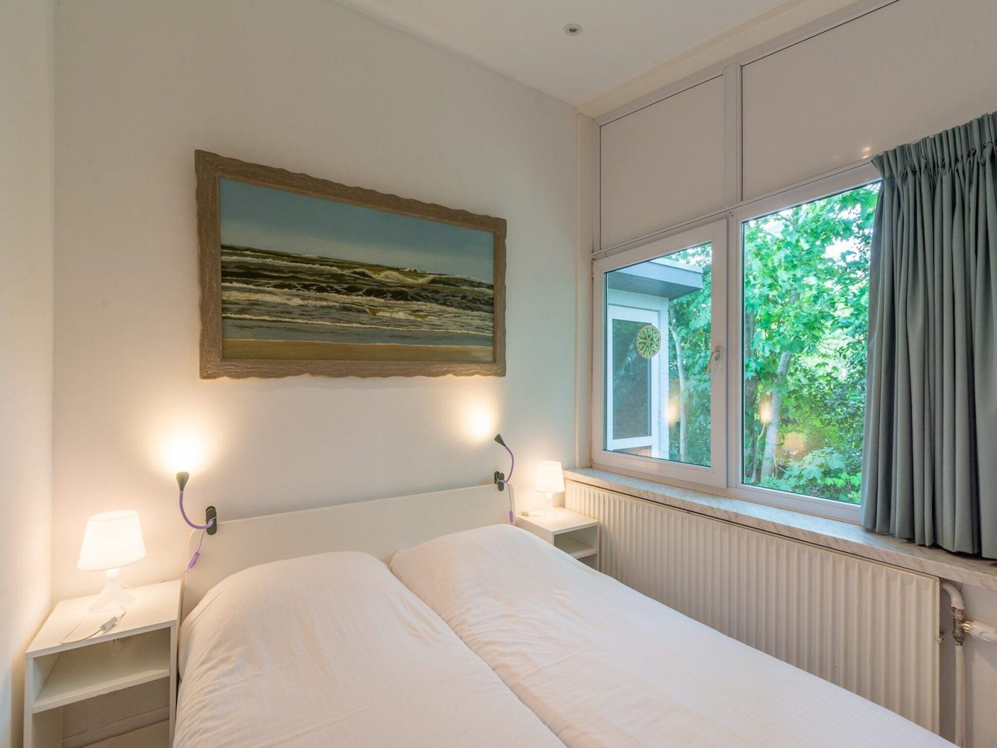 Een slaapkamer van Duinland 65 in Sint Maartenszee