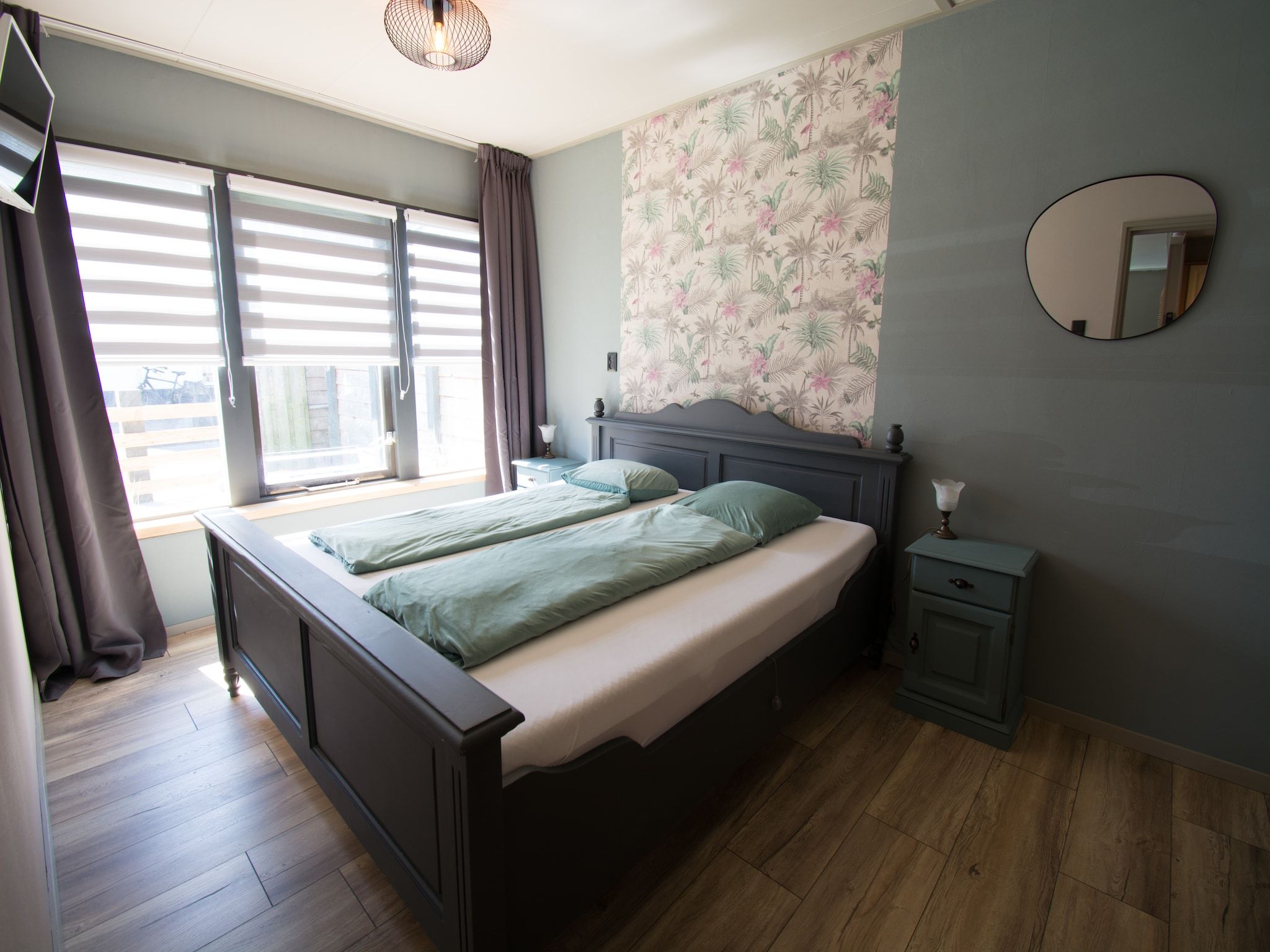 Een slaapkamer van Bungalow Mui aan Zee in Petten