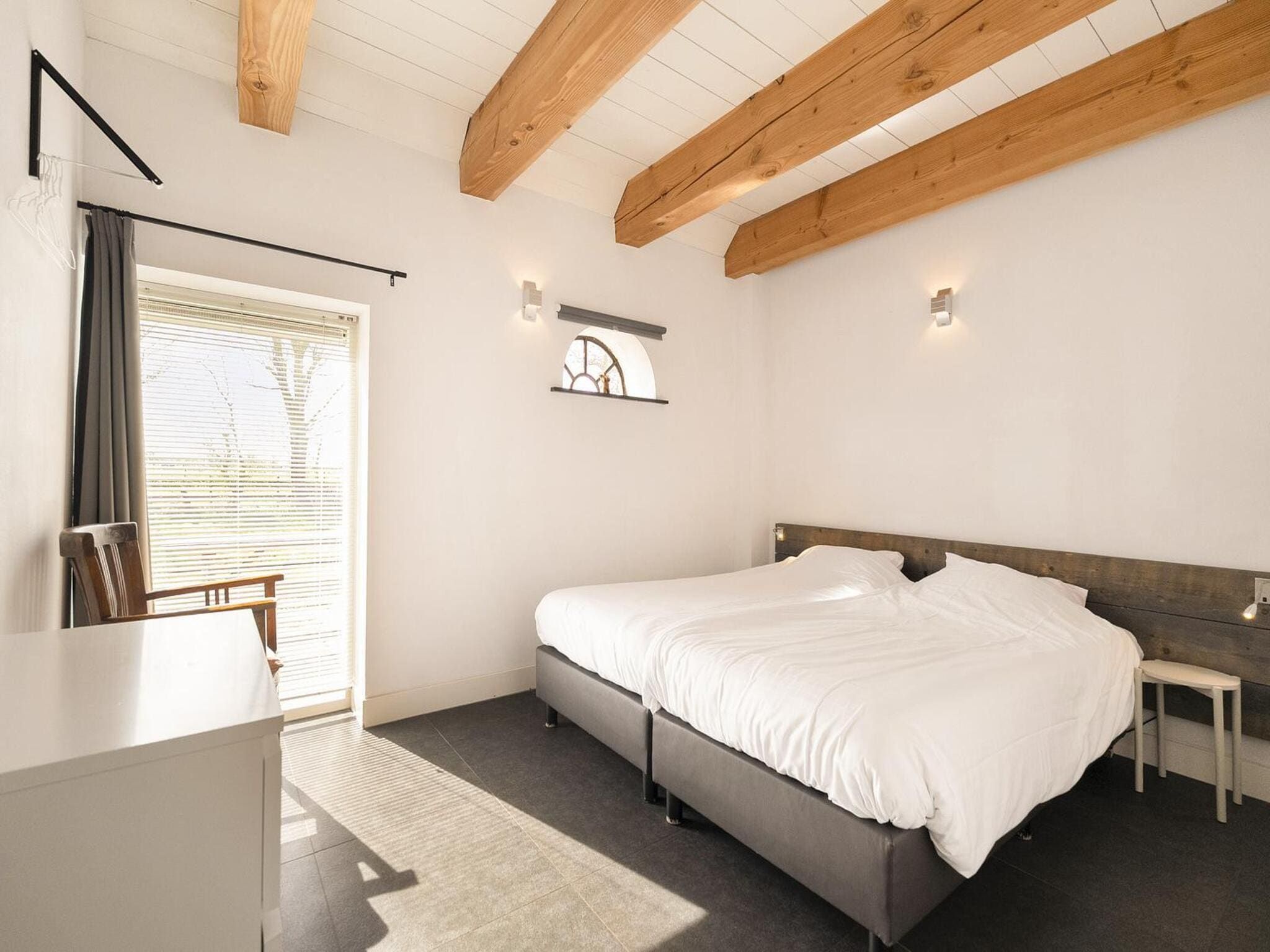 Een slaapkamer van Groepsaccomodatie - Balkenhoeve in Schagen