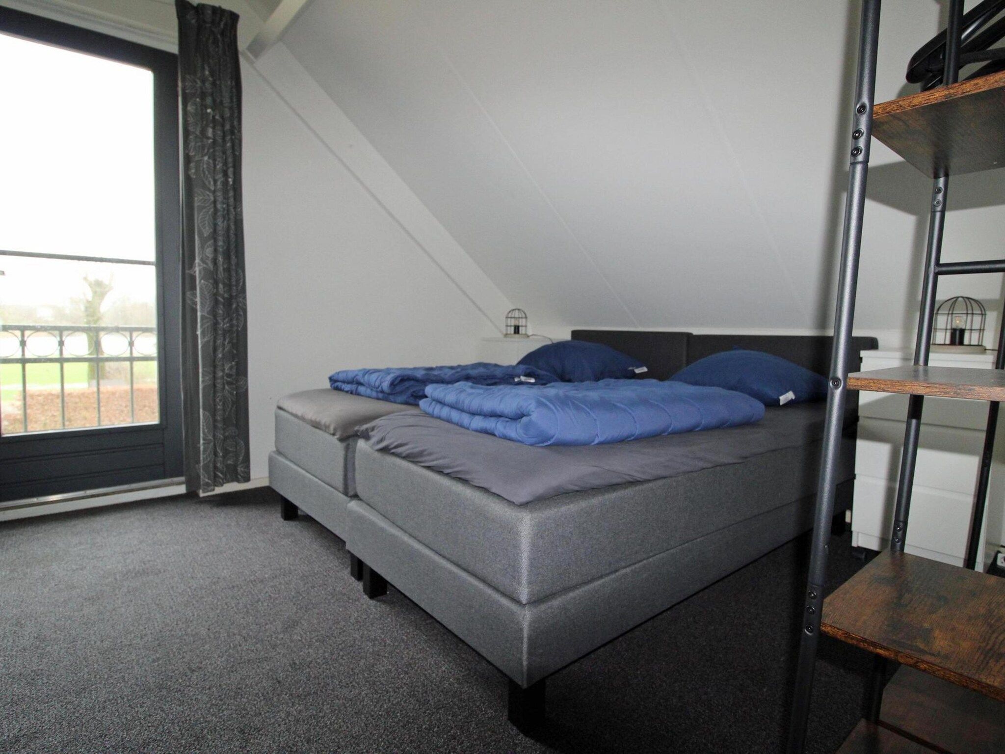 Een slaapkamer van 6 - Person Forest 28 Bungalow in Ewijk