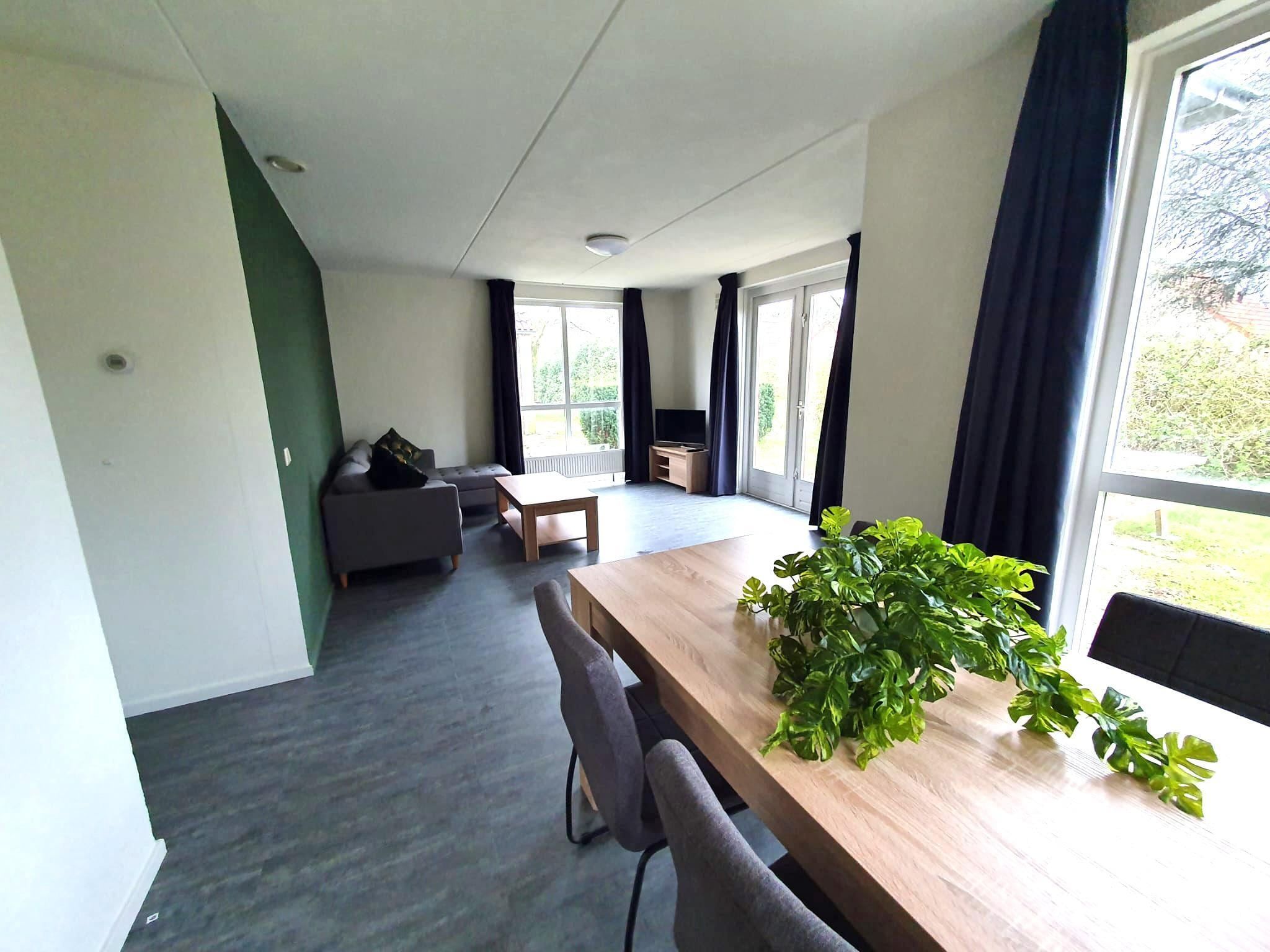 De woonkamer van 5 - Person Forest 10 Bungalow in Ewijk