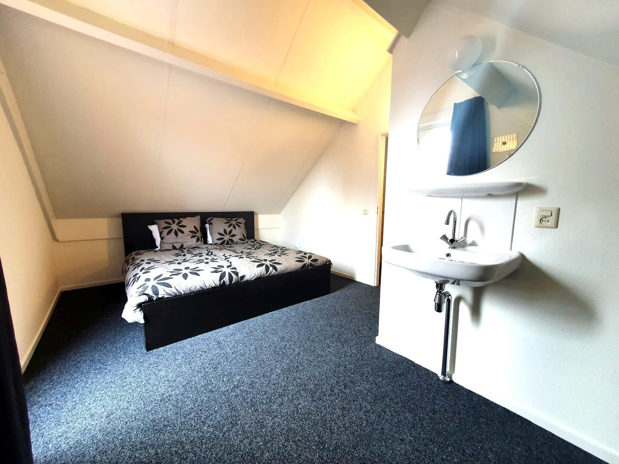 Een slaapkamer van 5 - Person Forest 10 Bungalow in Ewijk
