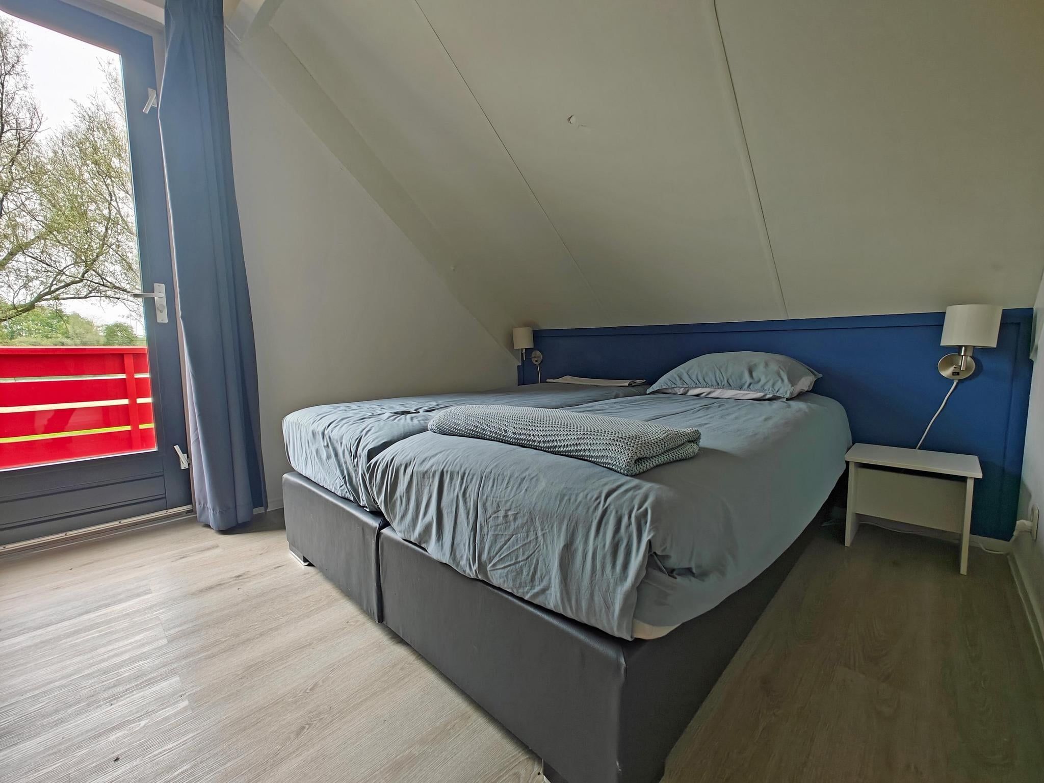 Een slaapkamer van 4 - Persons Lakeside Bungalow (copy) (copy) in Ewijk