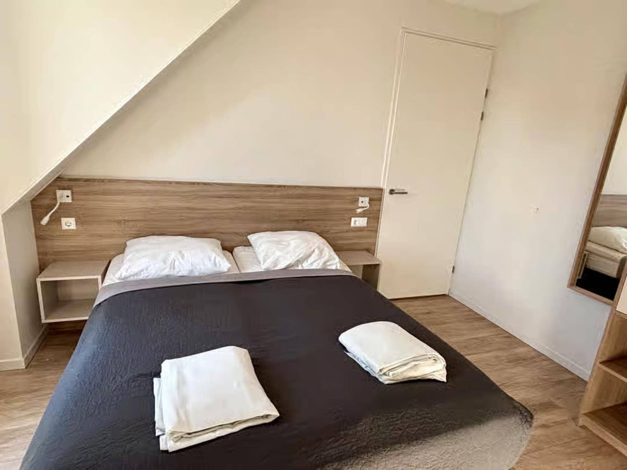 Een slaapkamer van Plein 40 Lodge 5 in Zoutelande