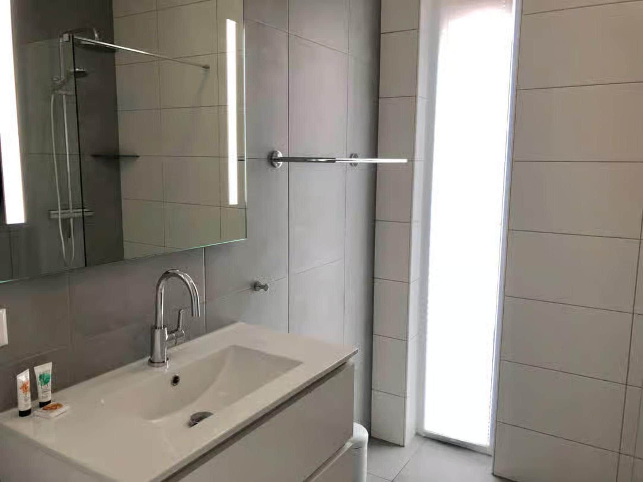 De badkamer van Plein 40 Lodge 8 in Zoutelande