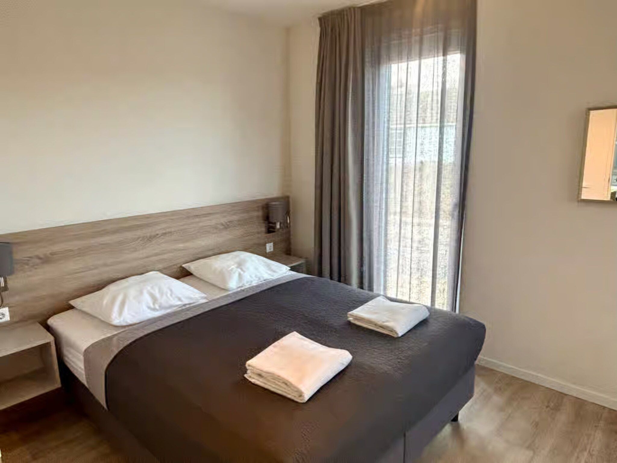 Een slaapkamer van Plein 40 Lodge 26 in Zoutelande