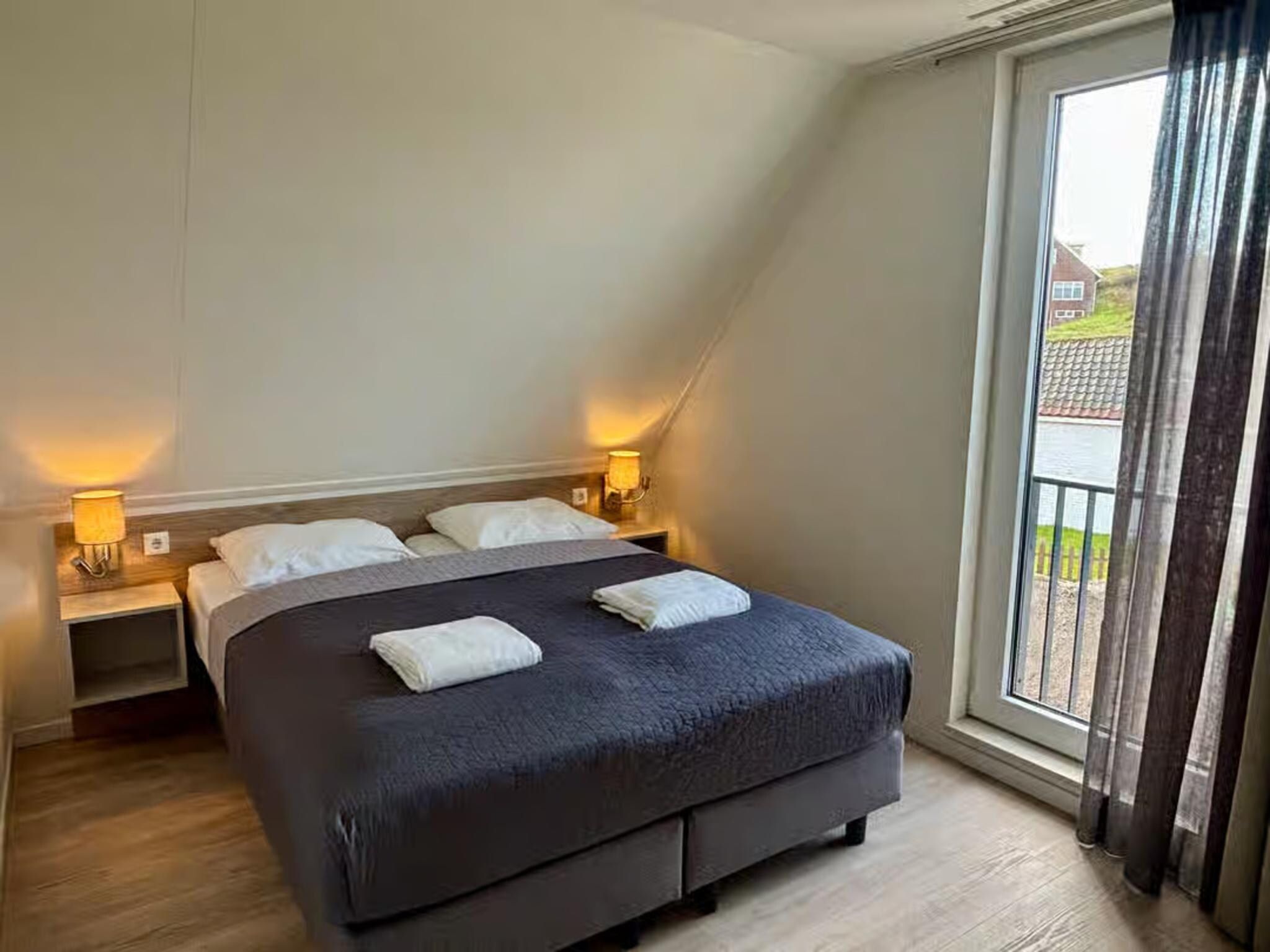 Een slaapkamer van Plein 40 Lodge 26 in Zoutelande