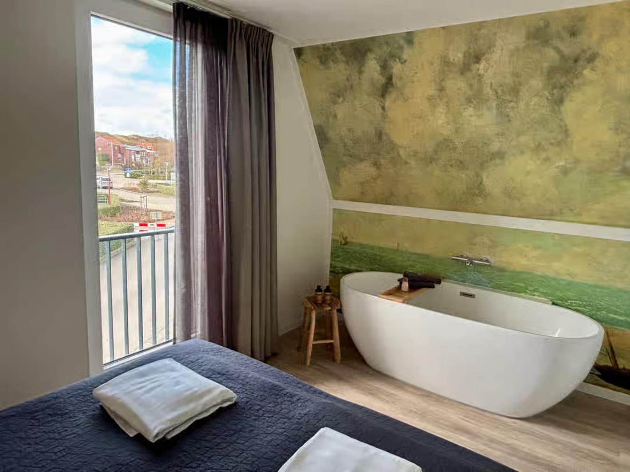 Een slaapkamer van Plein 40 Lodge 26 in Zoutelande