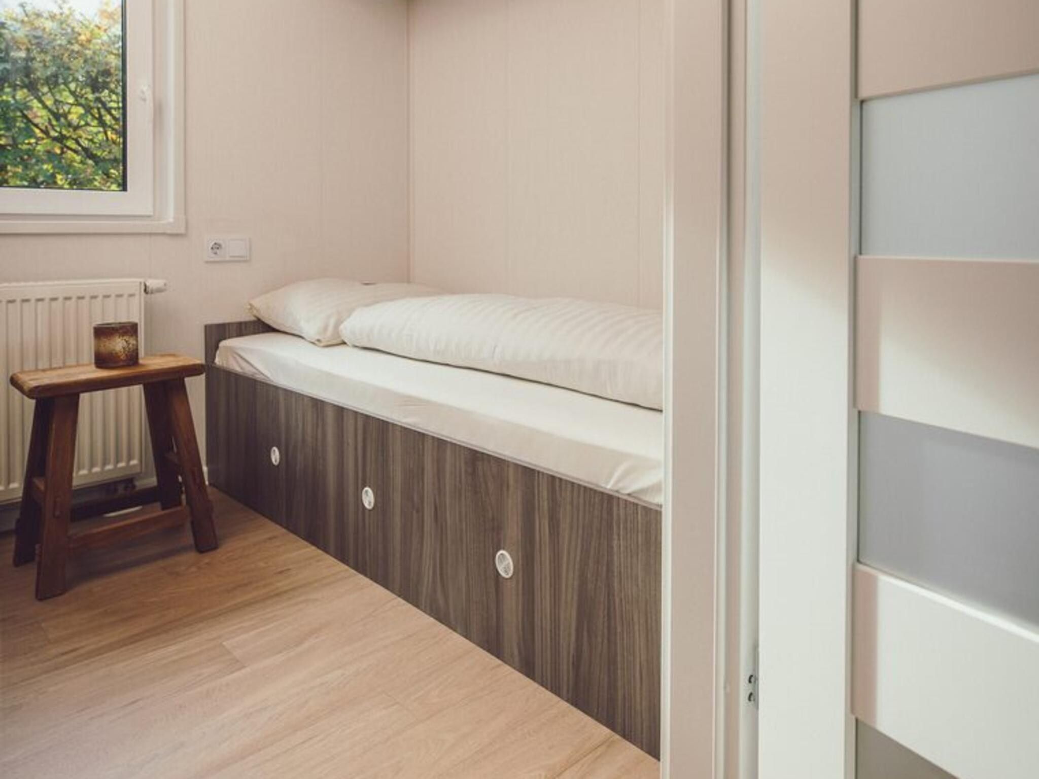 Een slaapkamer van Tiny Cabin with Hottub I 4 people in Rijssen