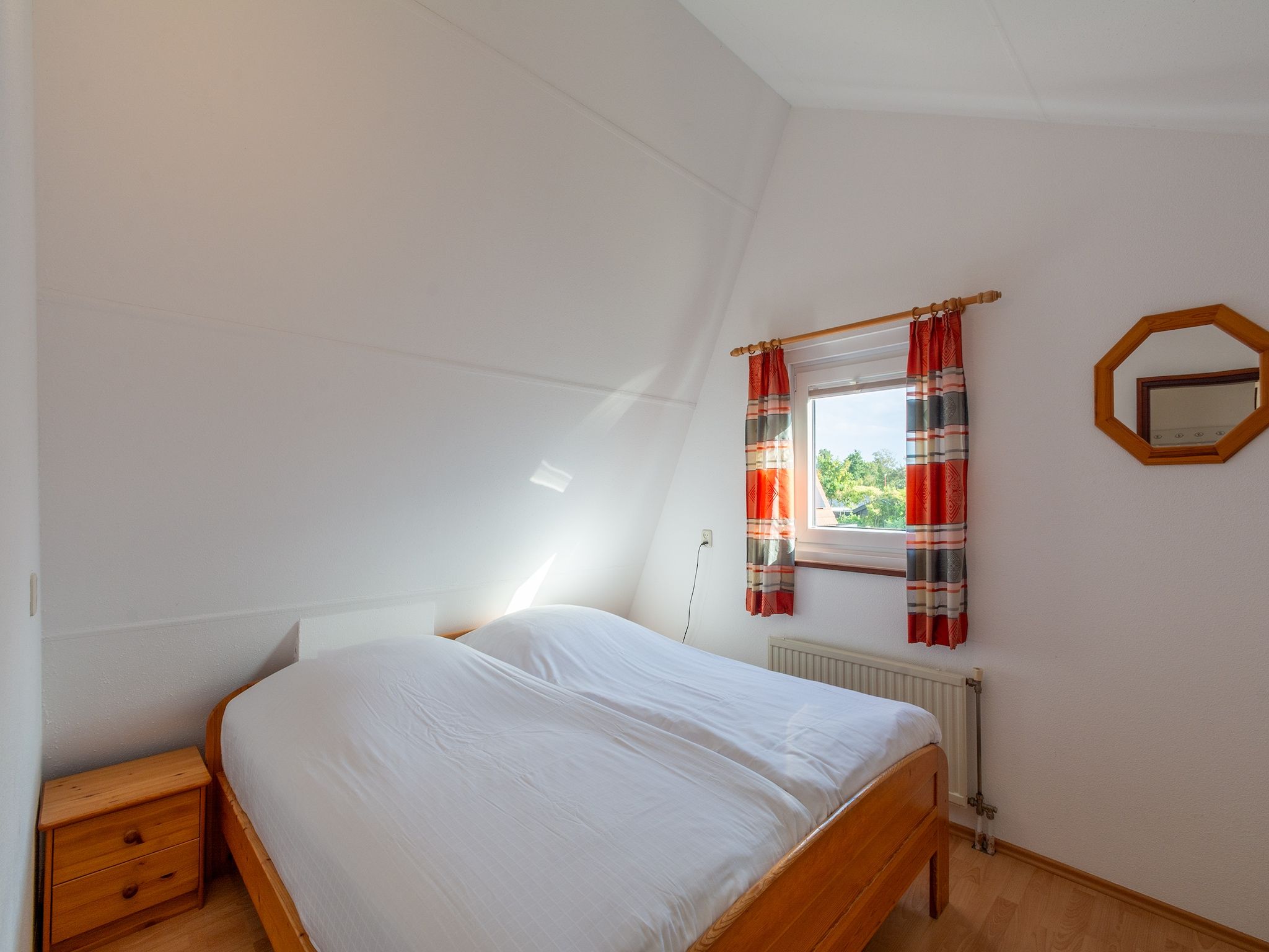Een slaapkamer van Yperhof 3 in Julianadorp aan Zee
