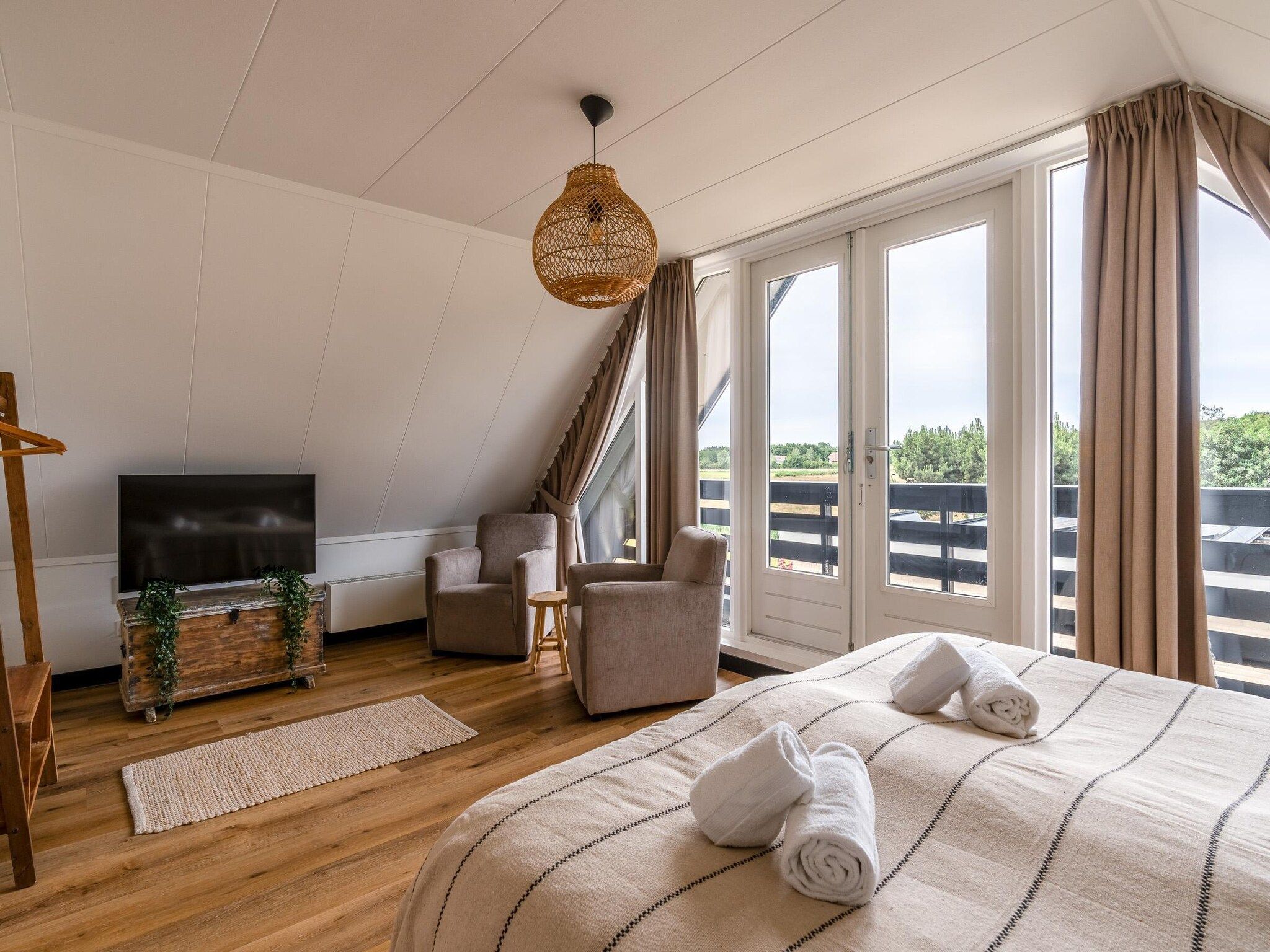 Een slaapkamer van Orchismient 17 in De Koog