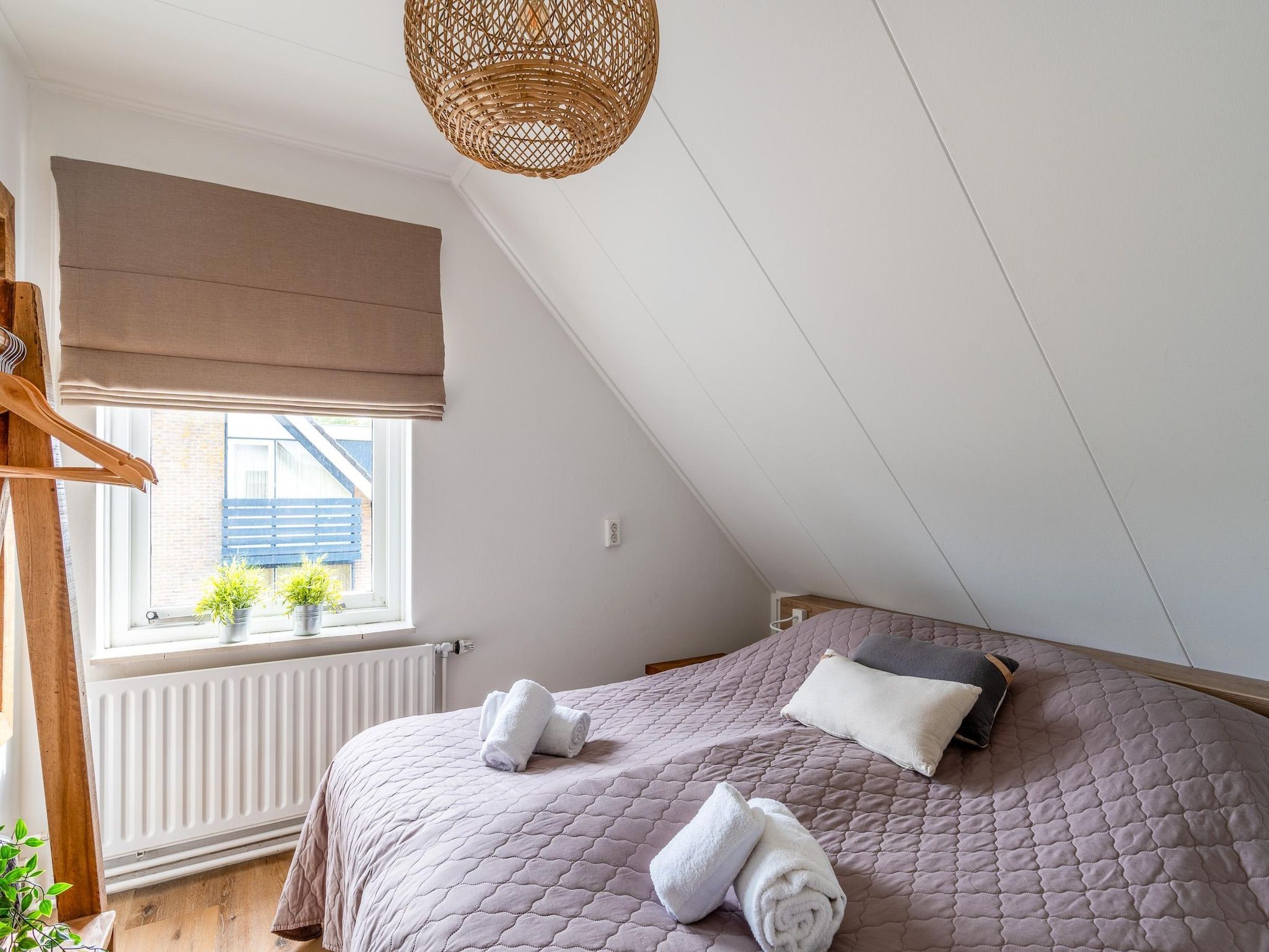 Een slaapkamer van Orchismient 17 in De Koog