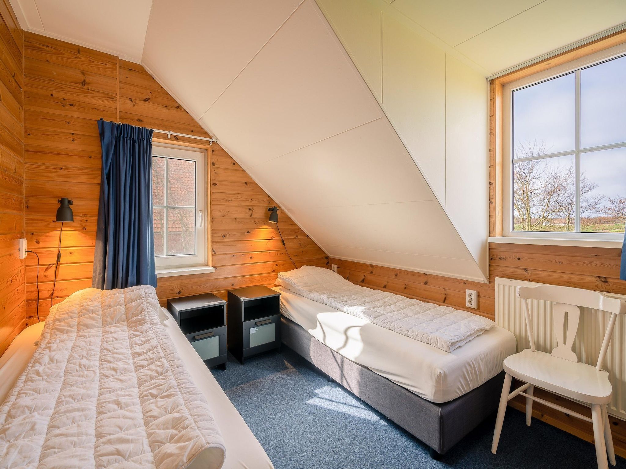 Een slaapkamer van De Annabella 13- De Tjiftjaf in De Koog
