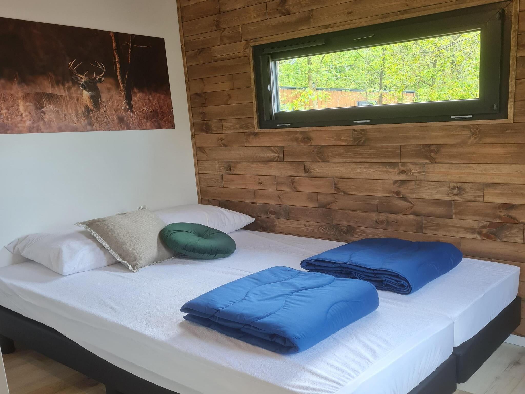 Een slaapkamer van Tiny house | 2-4 persoons in Balkbrug