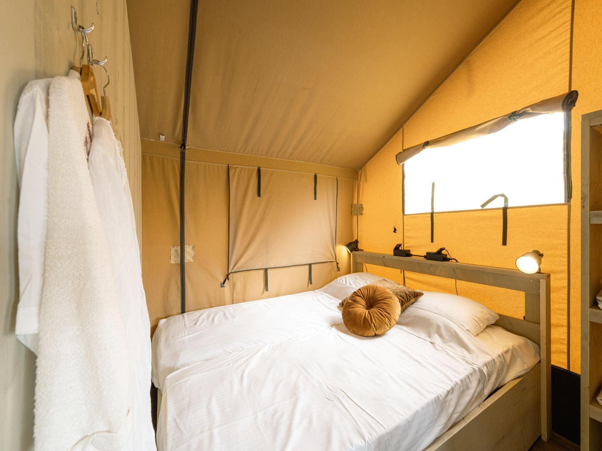 Een slaapkamer van Ranger lodge | 6 persoons in Balkbrug